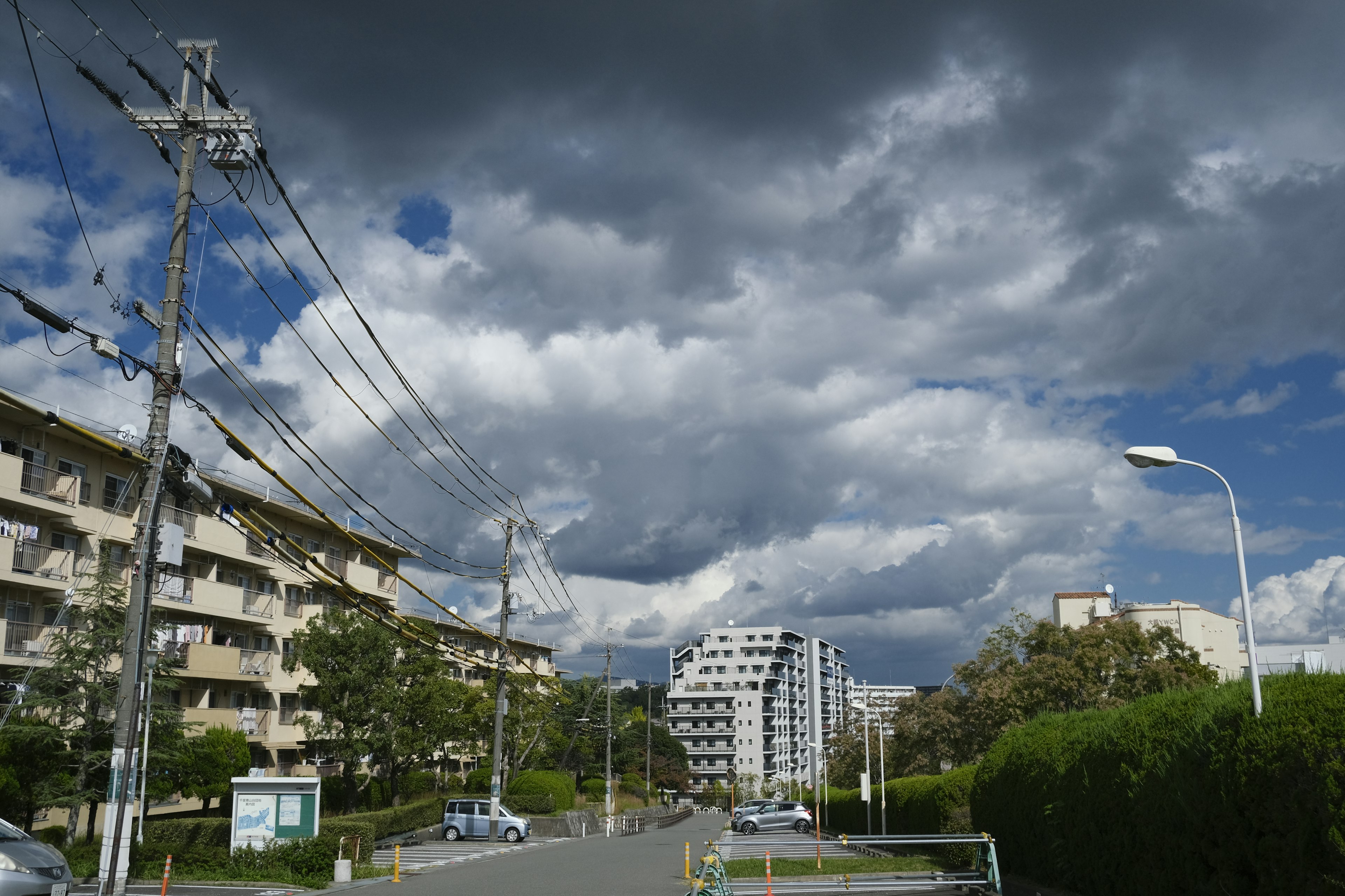 Urban street scene with cloudy sky