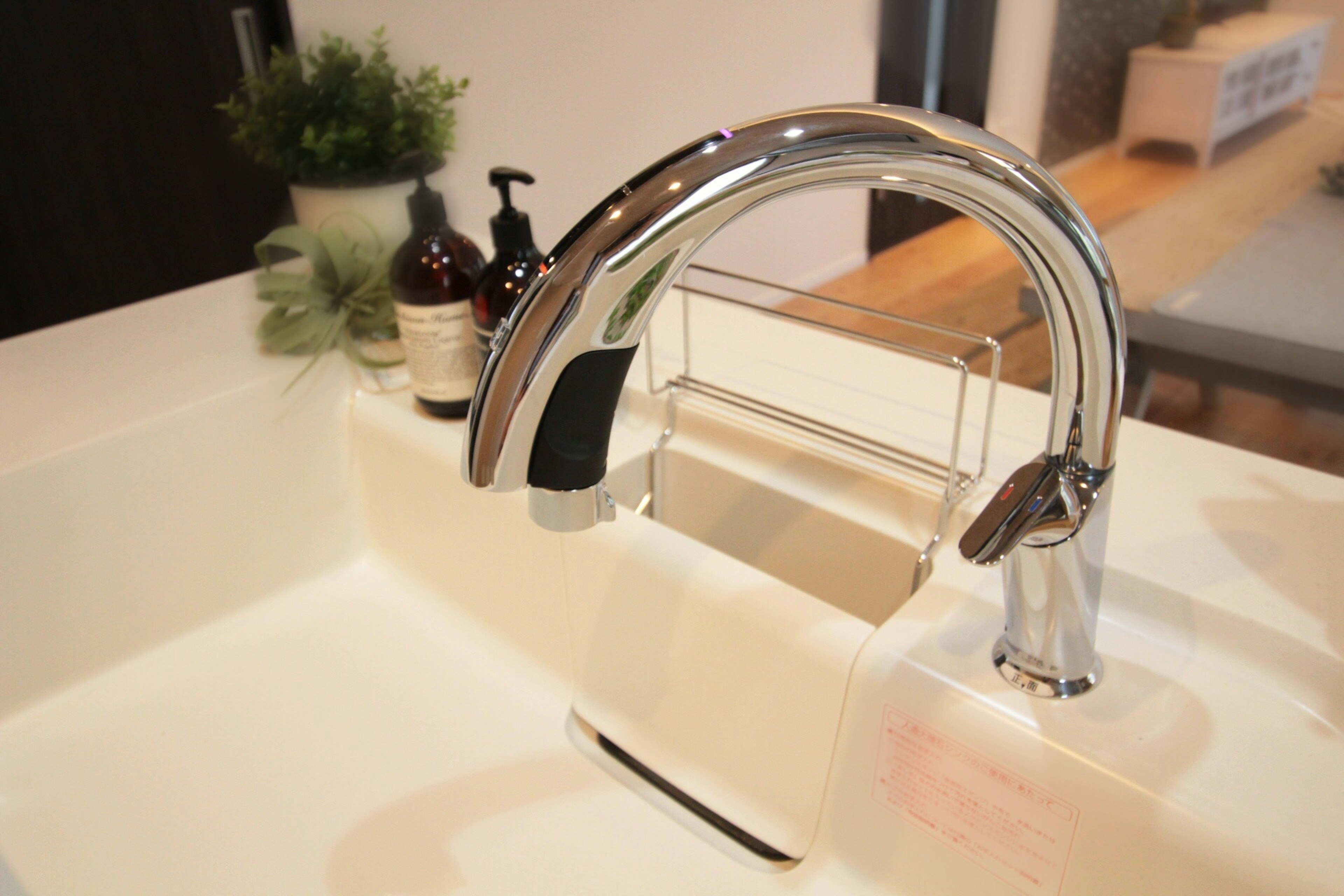 Stylish sink with chrome faucet near a countertop