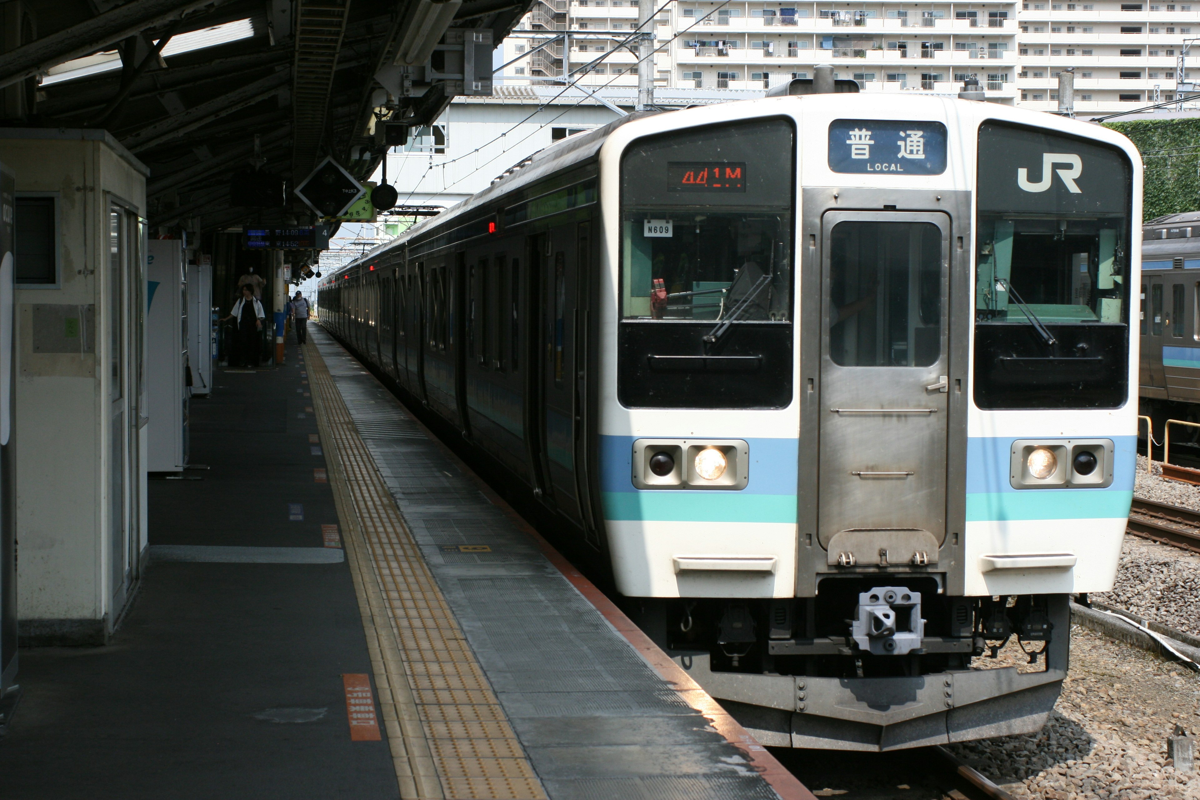 JR train arriving at a station platform