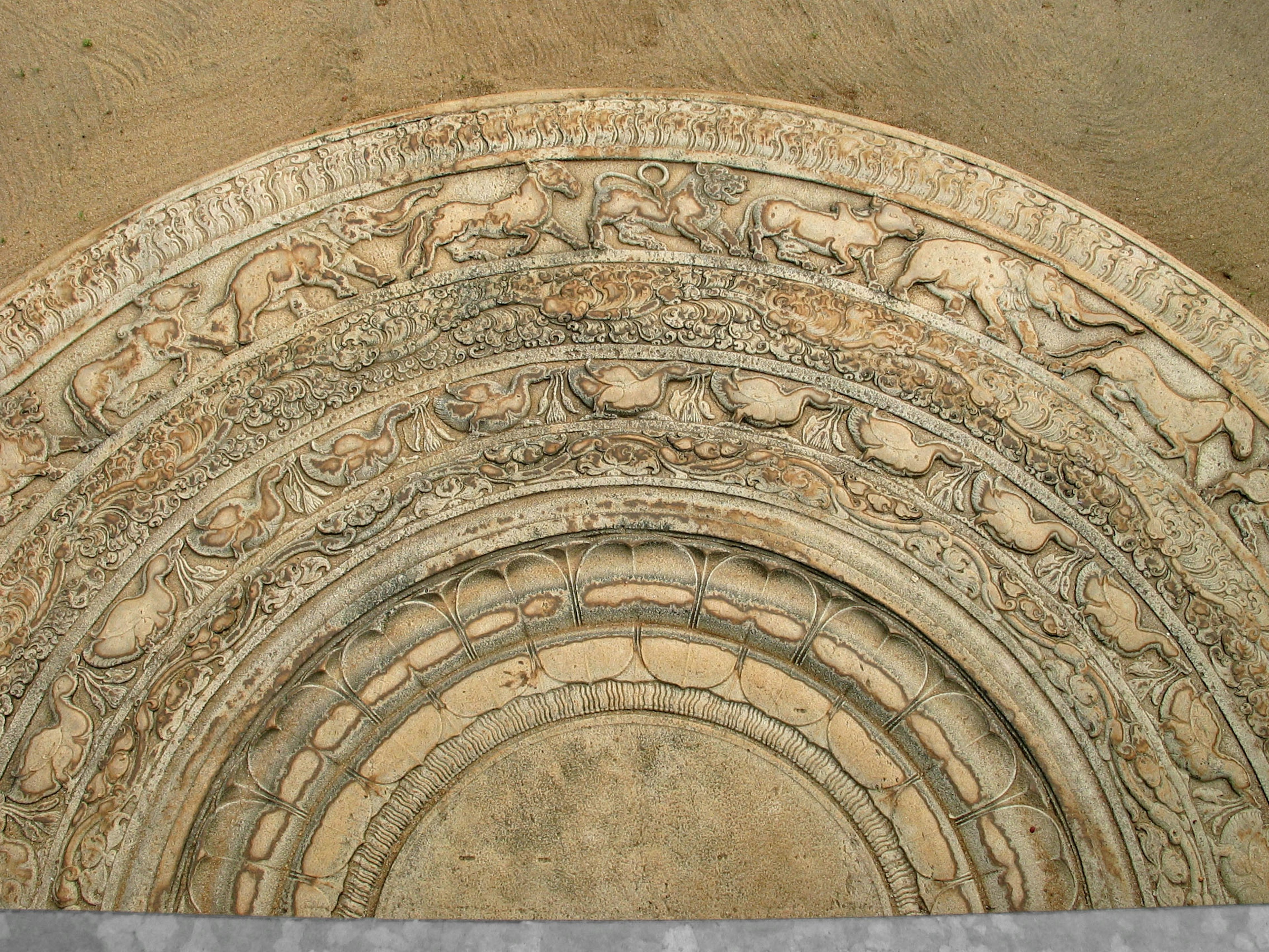 Decorative archway with intricate carvings featuring animals and patterns