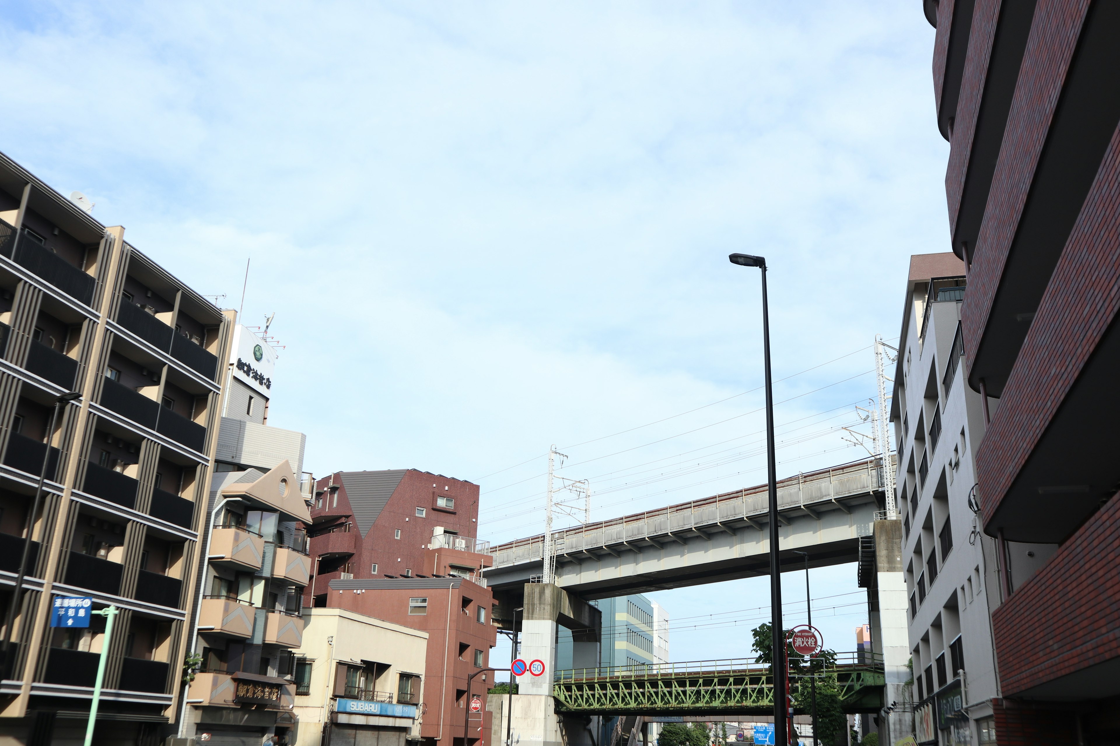 Urban landscape featuring elevated railway and buildings