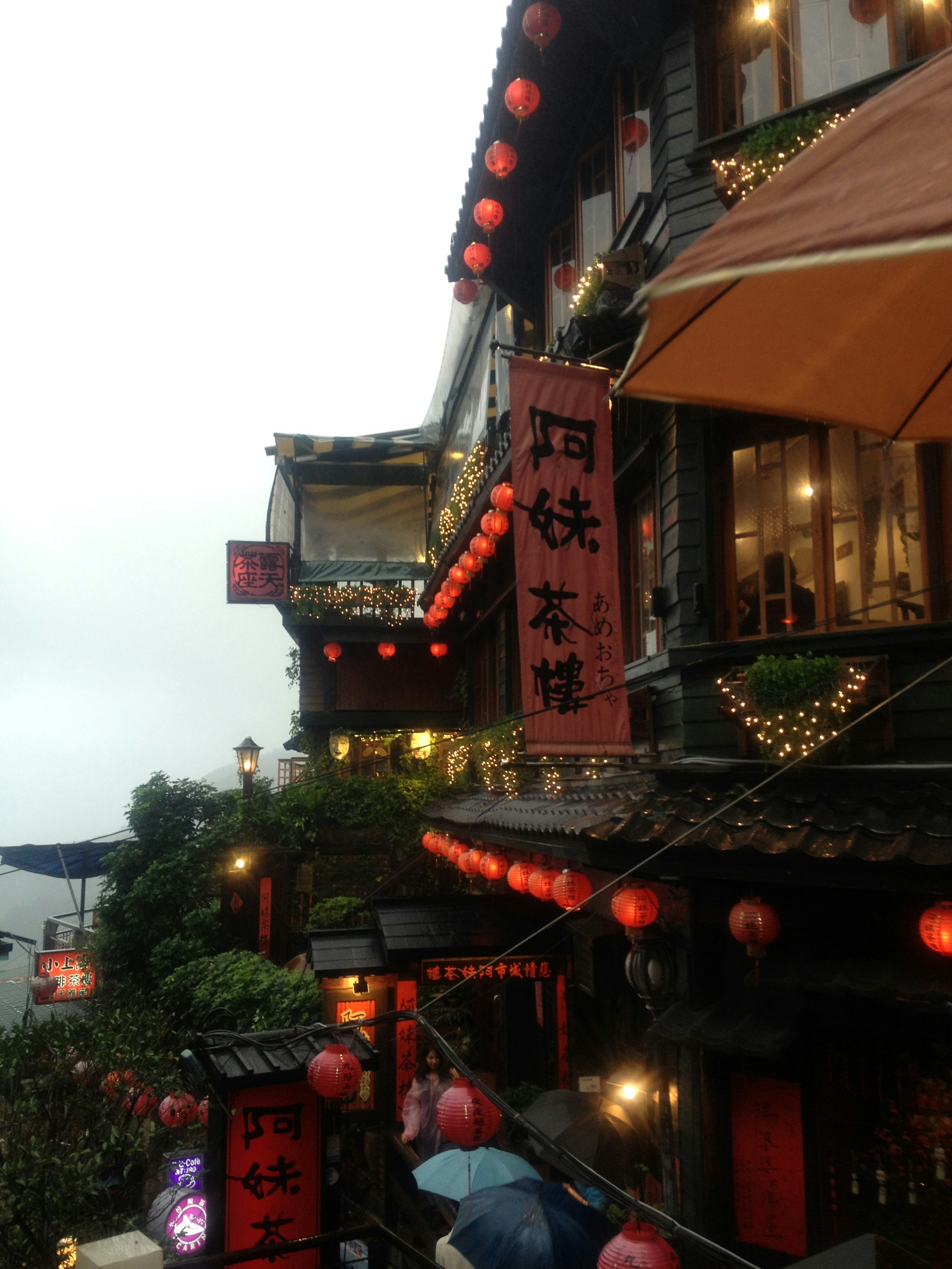 Charming streetscape featuring red lanterns and traditional buildings