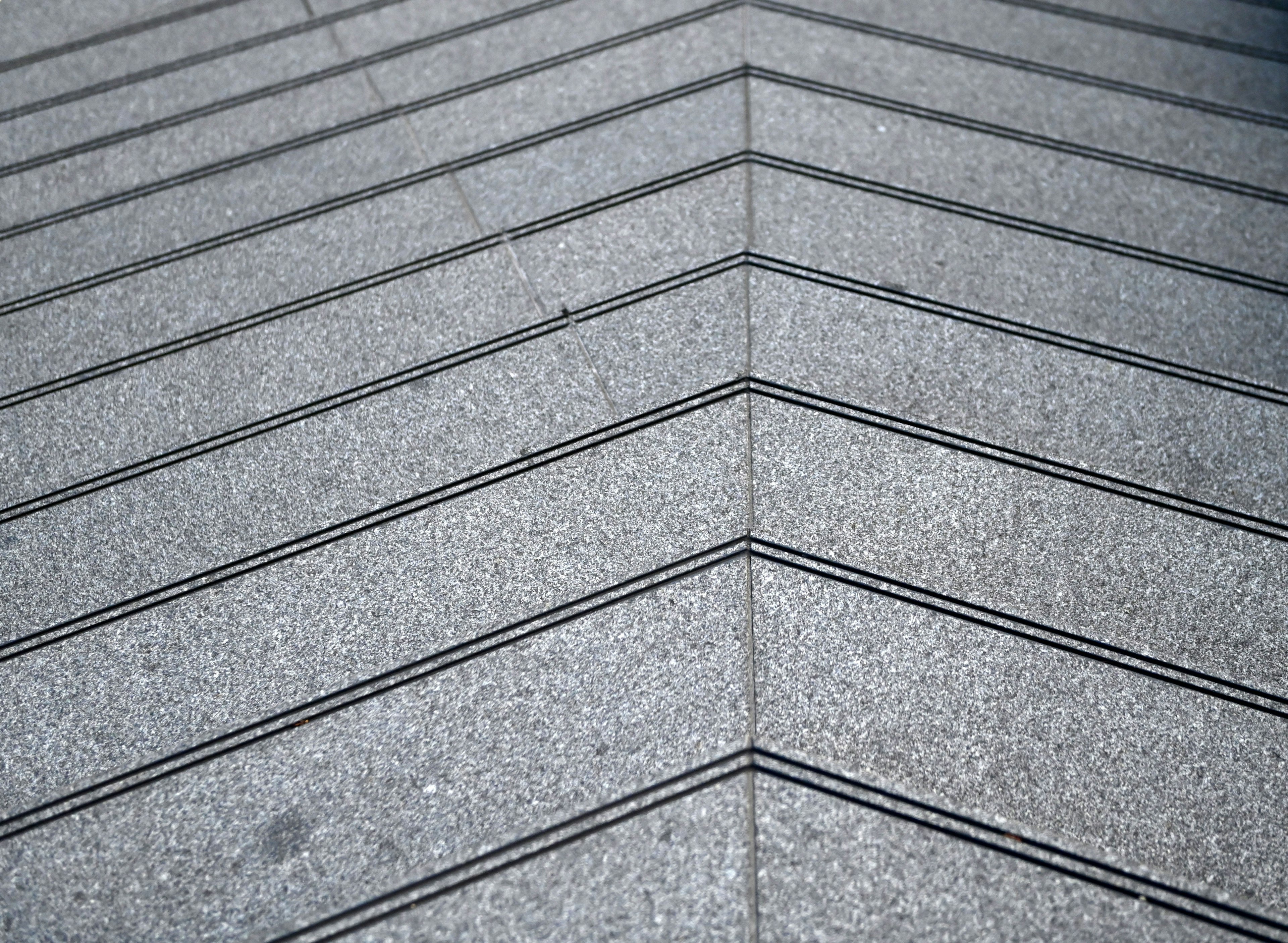 Image of a gray tiled floor with diagonal patterns