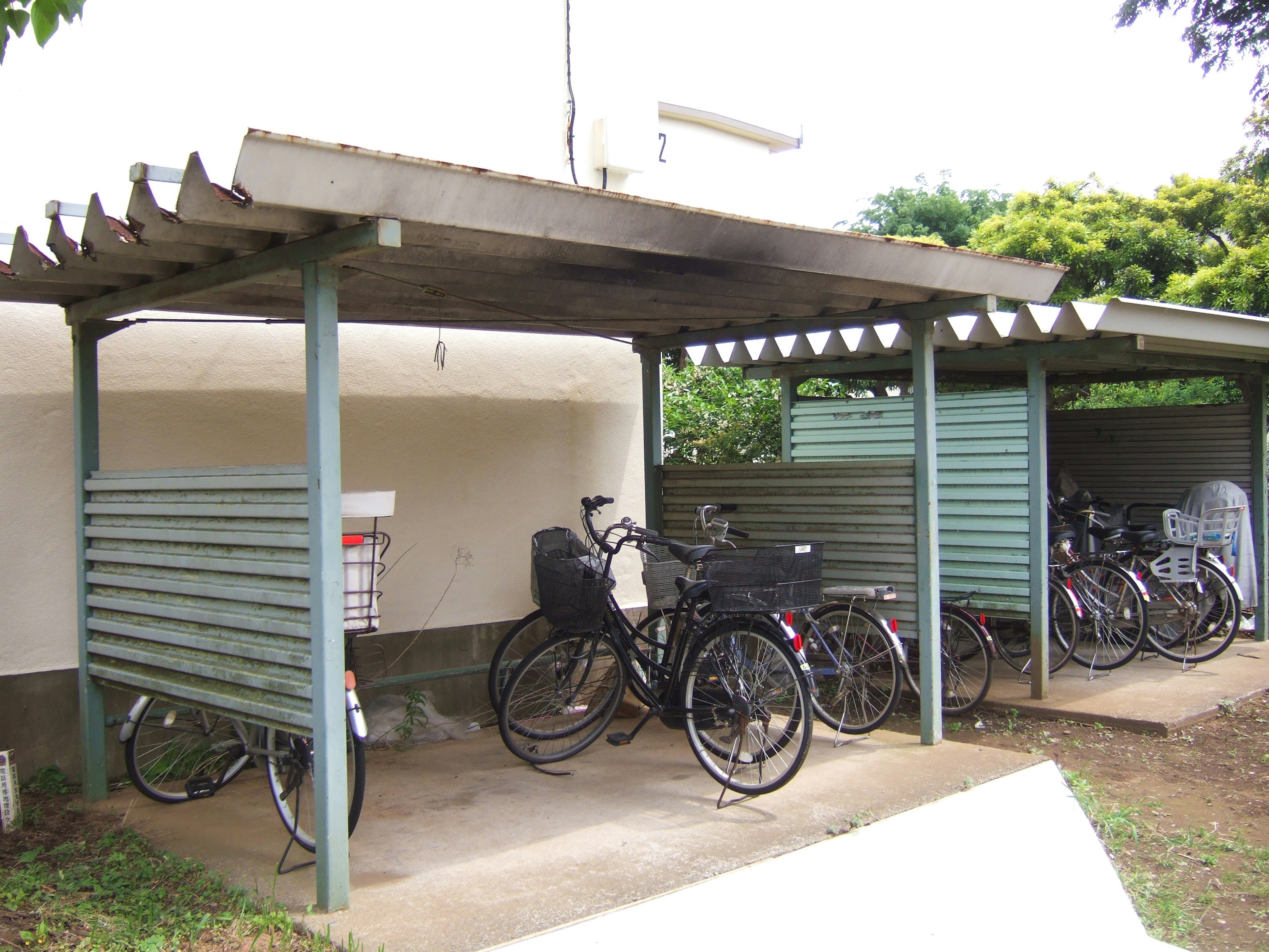 Bicycle parking area with covered shelters and parked bikes