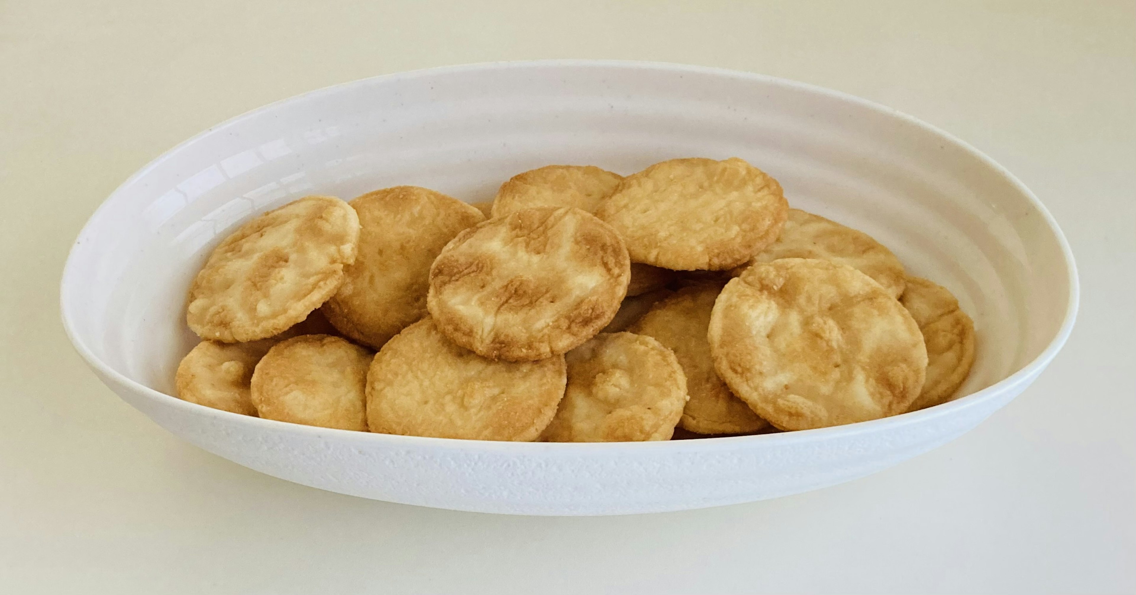 Crispy baked treats arranged in a white bowl