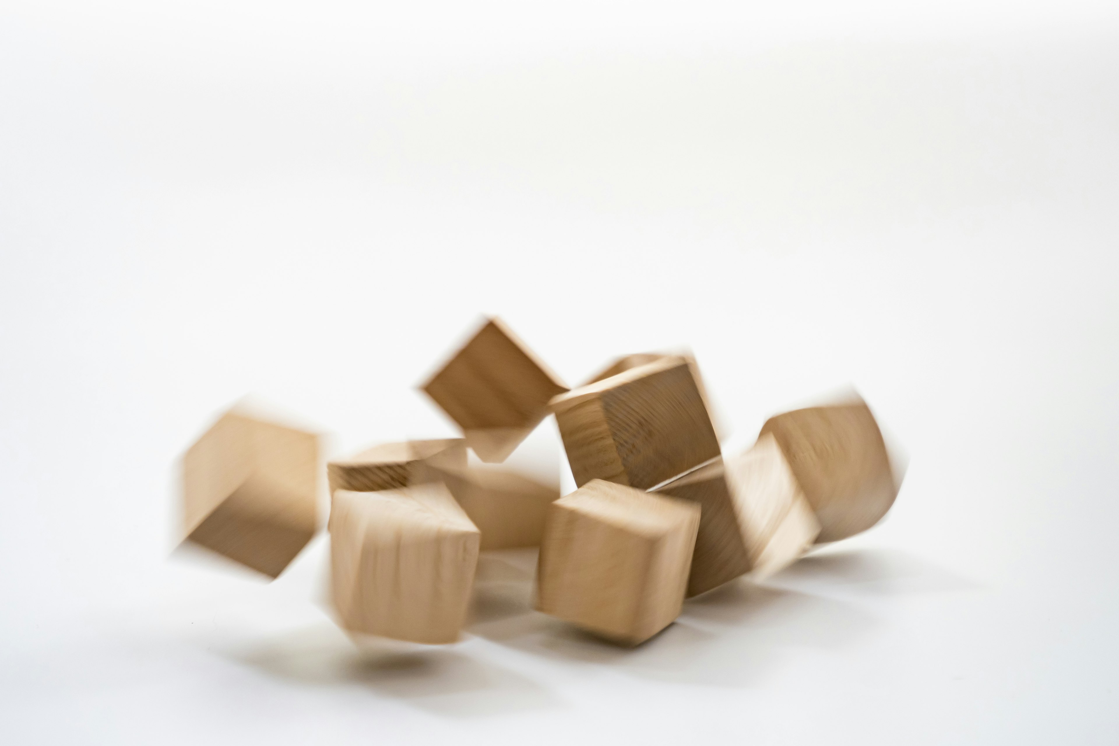 Scattered wooden cubes on a light background