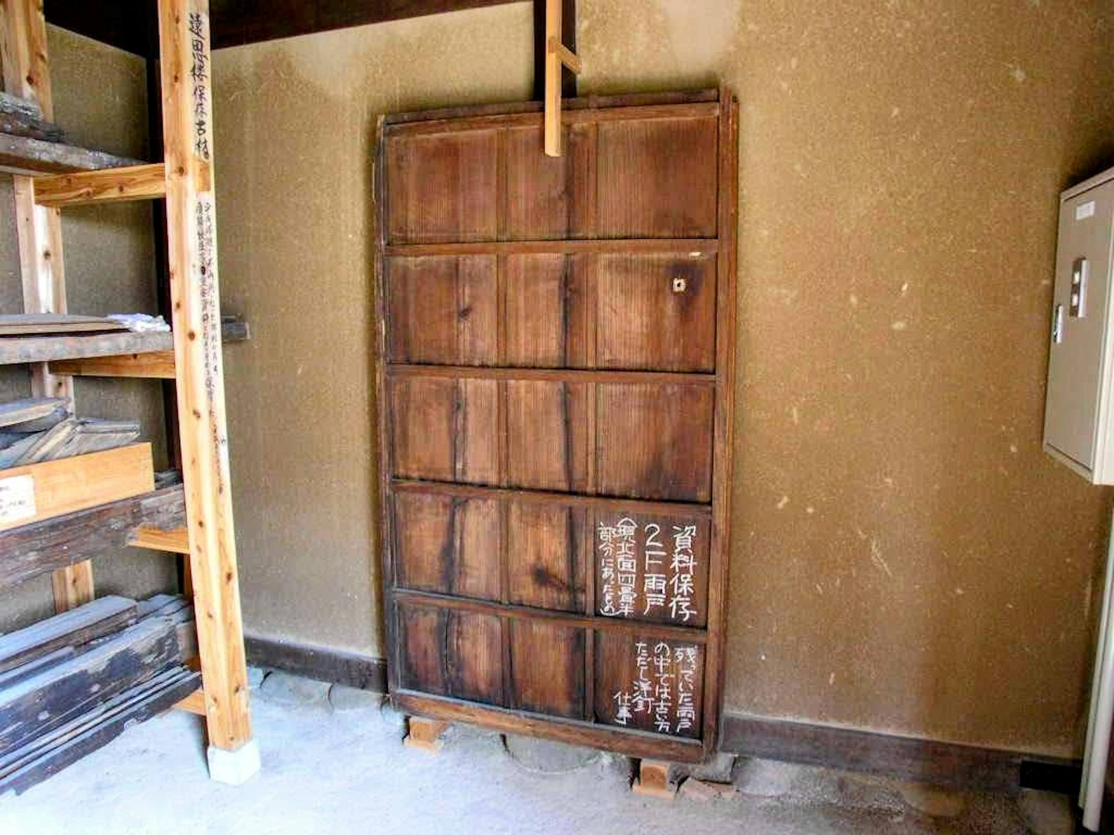 Interior view of a room with a wooden storage shelf