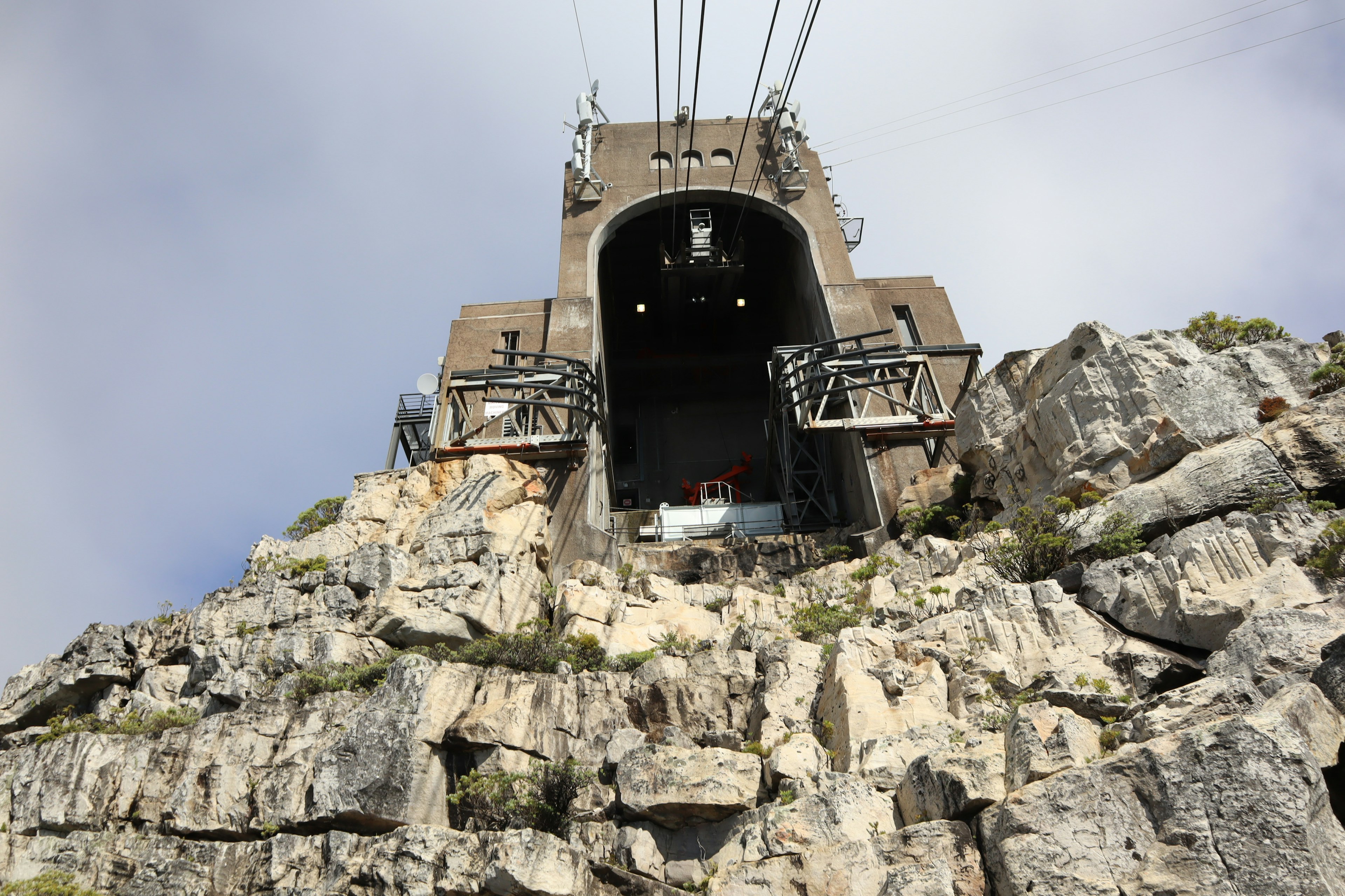 Cable car station on a rocky mountain with a dramatic entrance