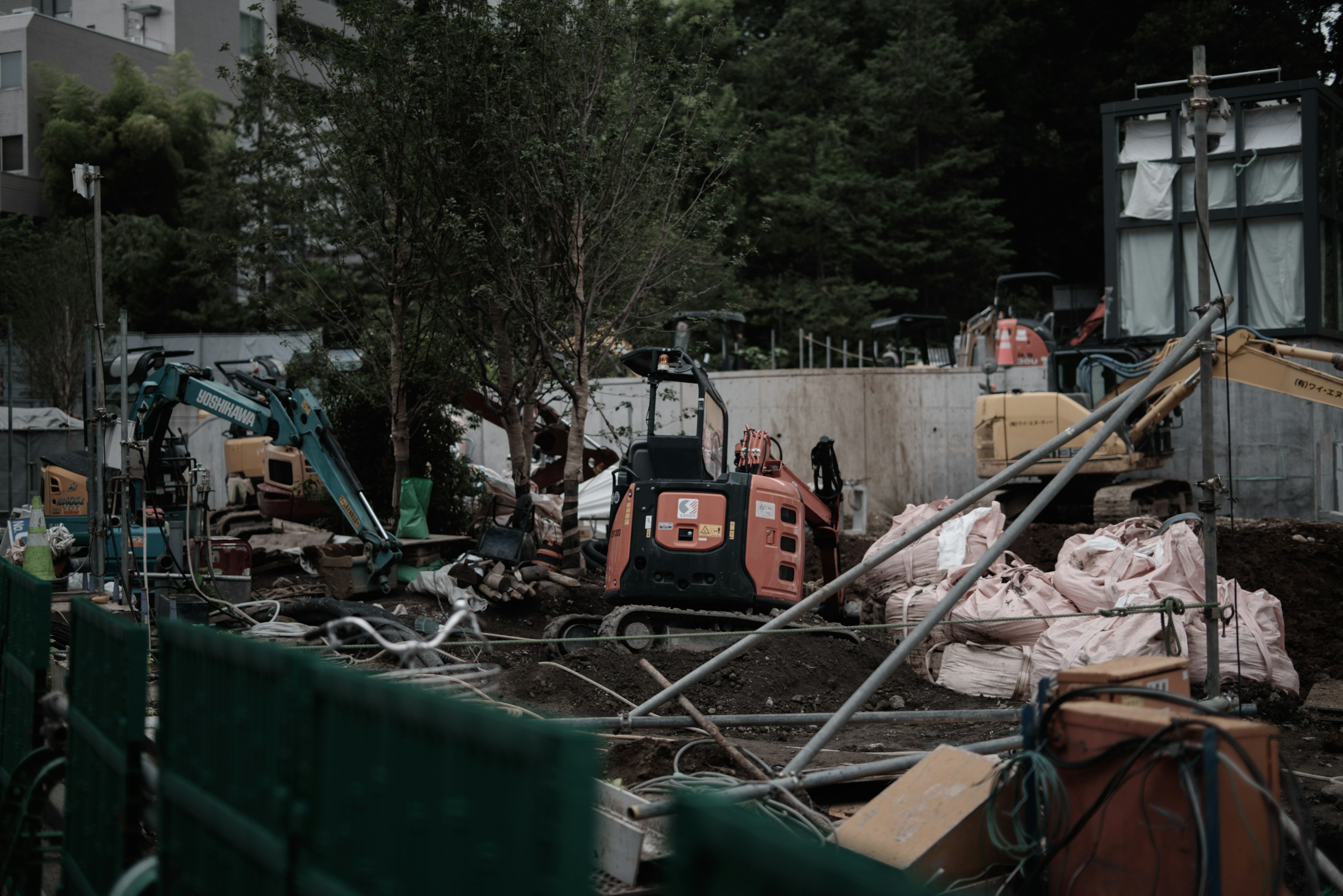 Construction site with machinery and scattered materials