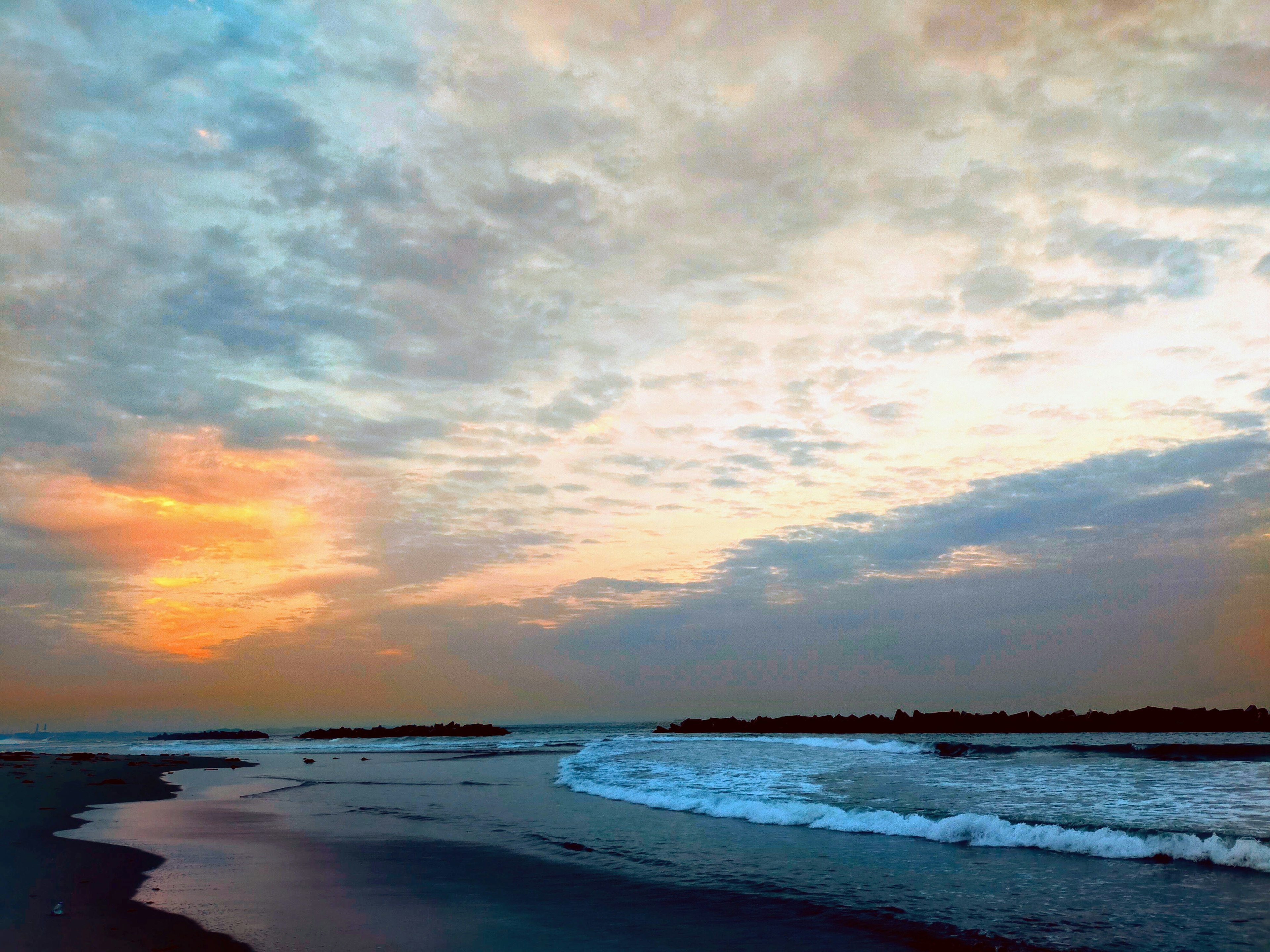 Beautiful sunset over the coastline with waves