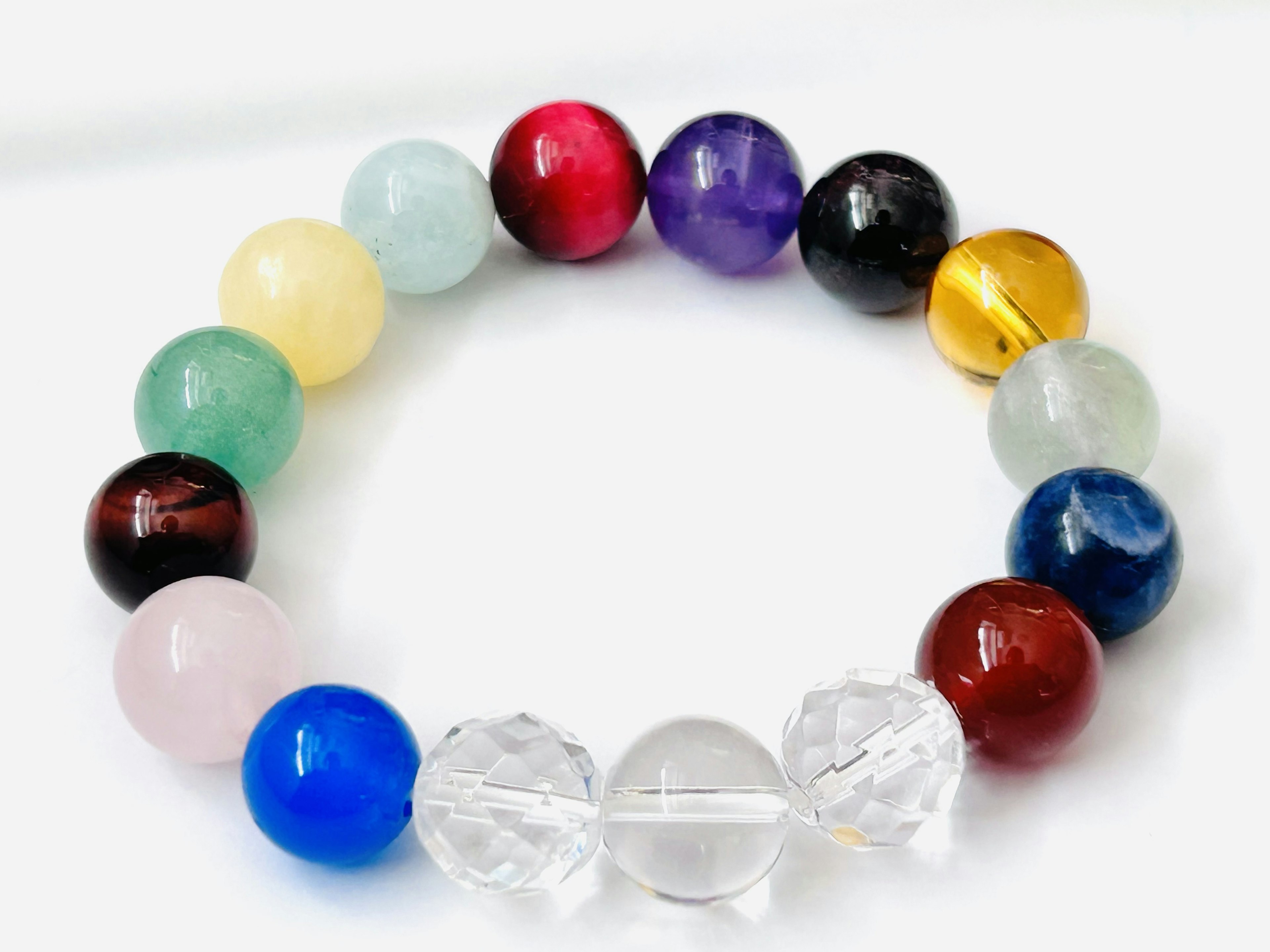 Colorful natural stone beads arranged in a circular pattern