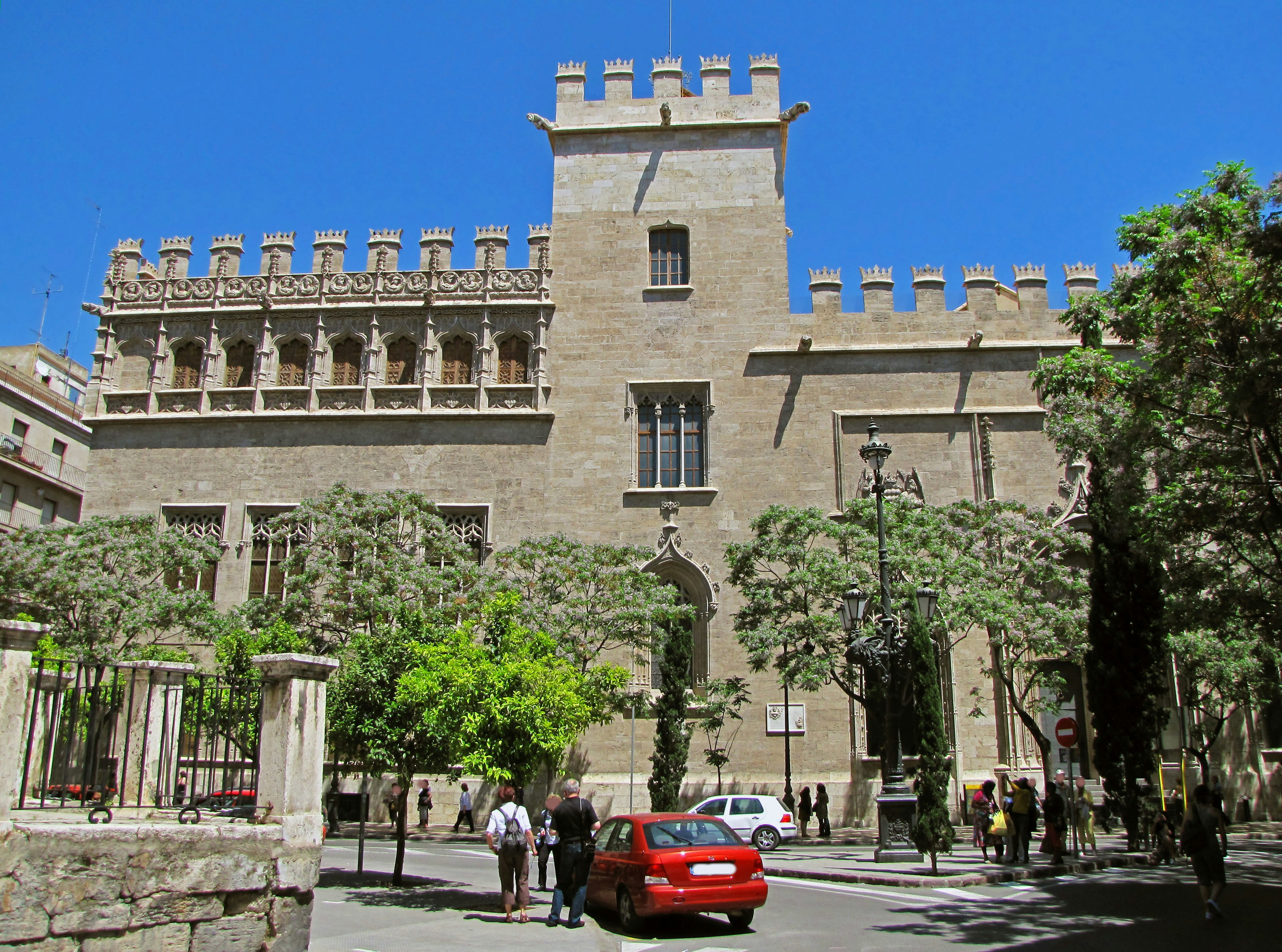 Historic building in Valencia with a castle-like design and blue sky