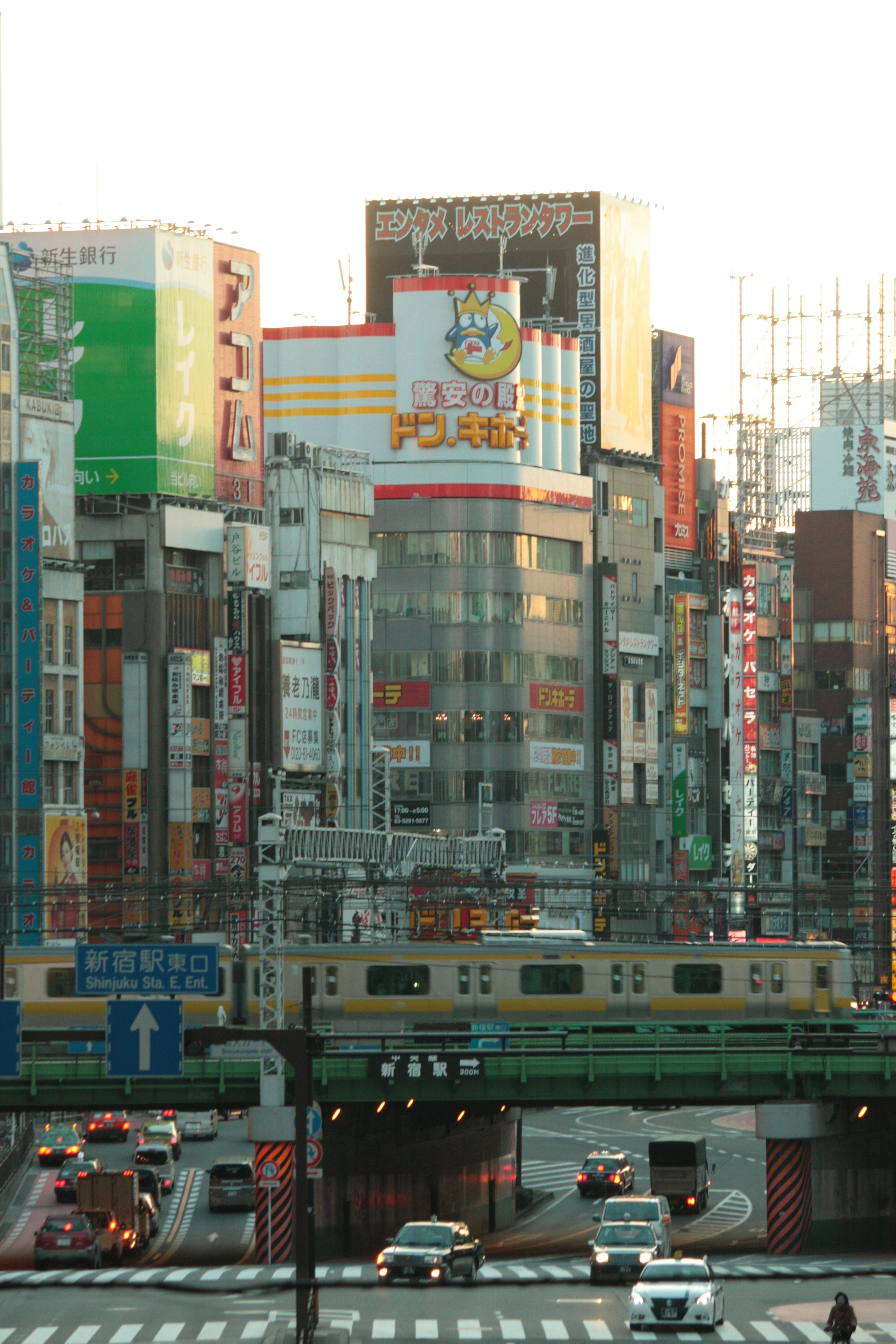 Vibrant cityscape with colorful buildings and a train passing