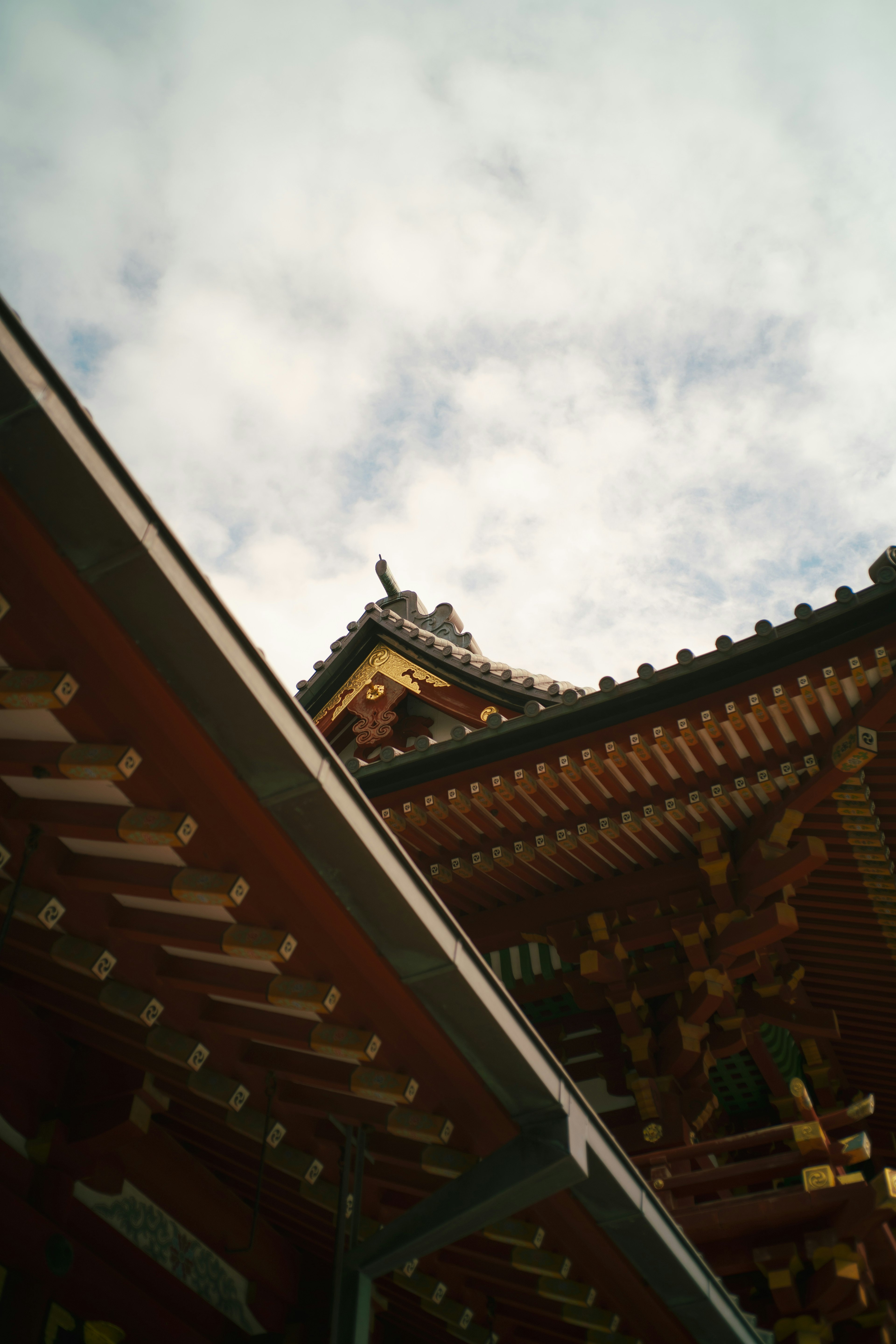 Image showing part of a traditional building's roof with cloudy sky