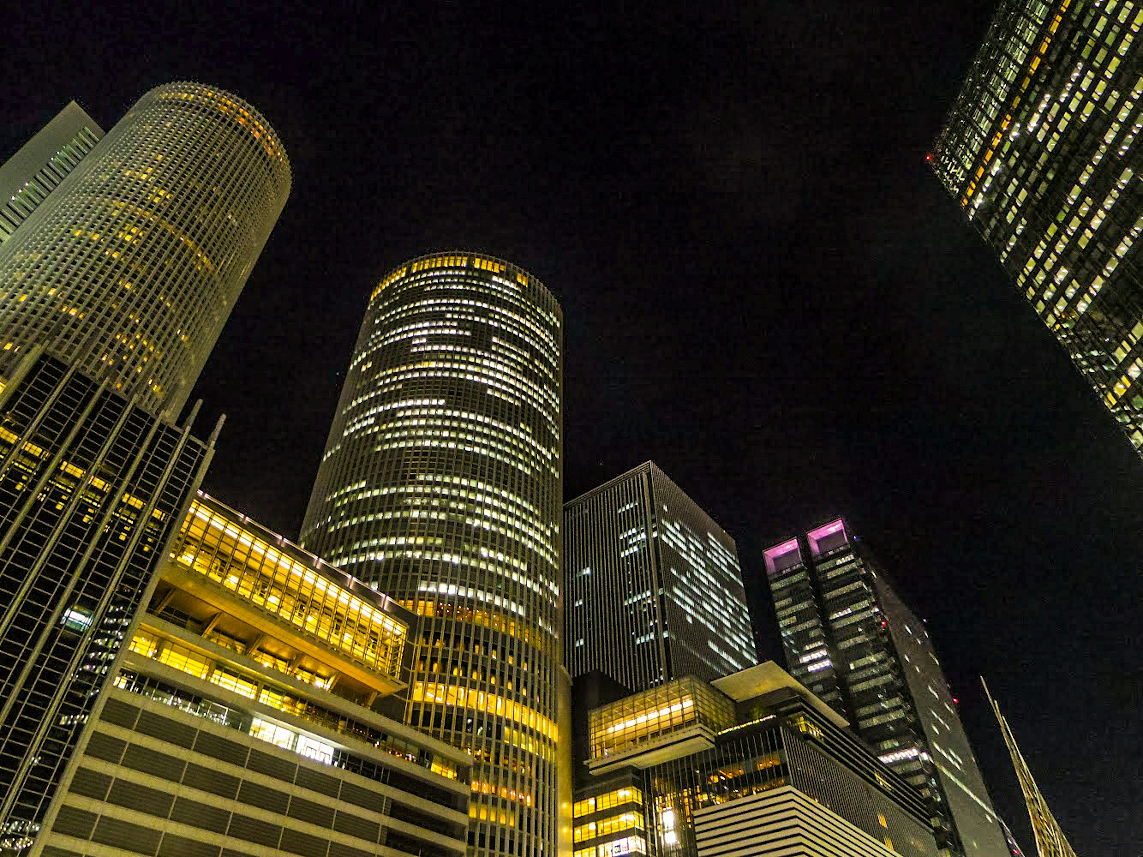 City skyline with illuminated skyscrapers at night