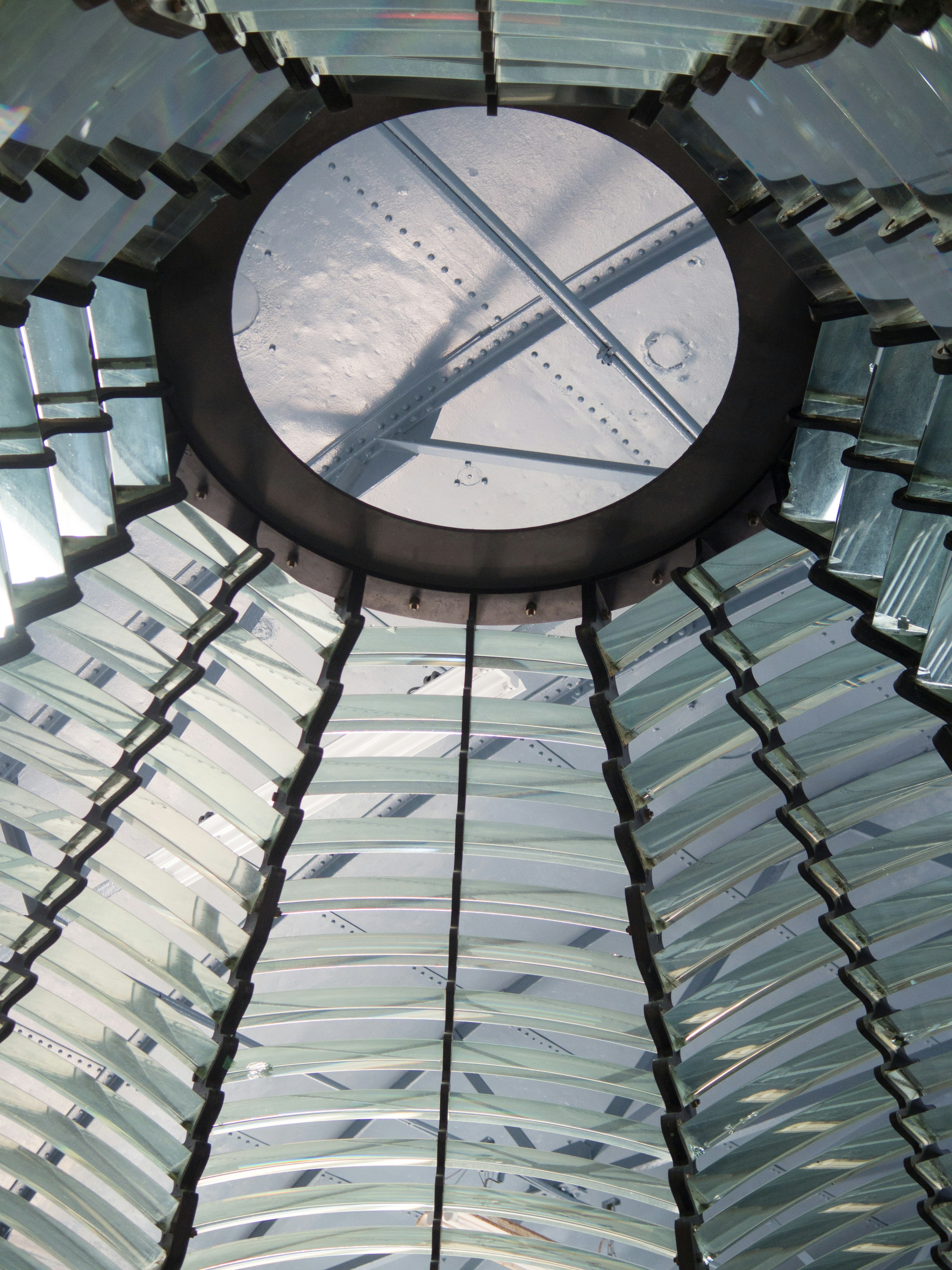 Glass structure viewed from a circular roof with shadows