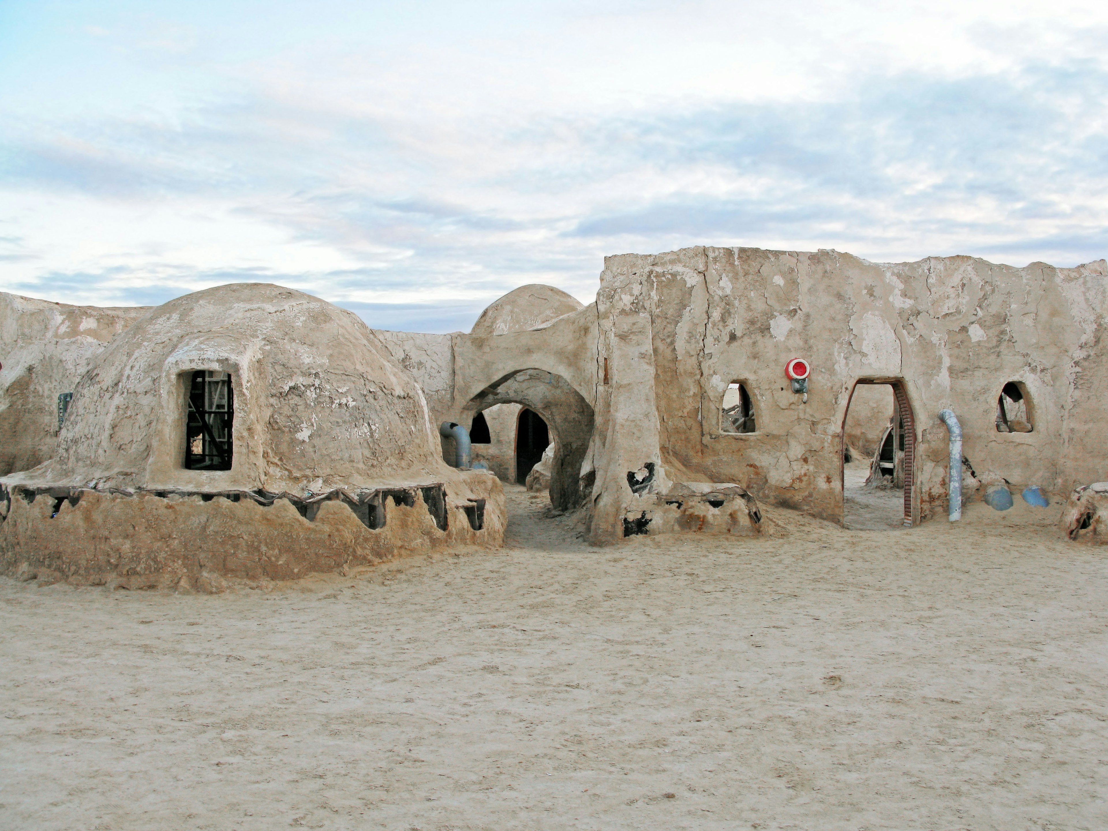 Old adobe structures in a desert landscape