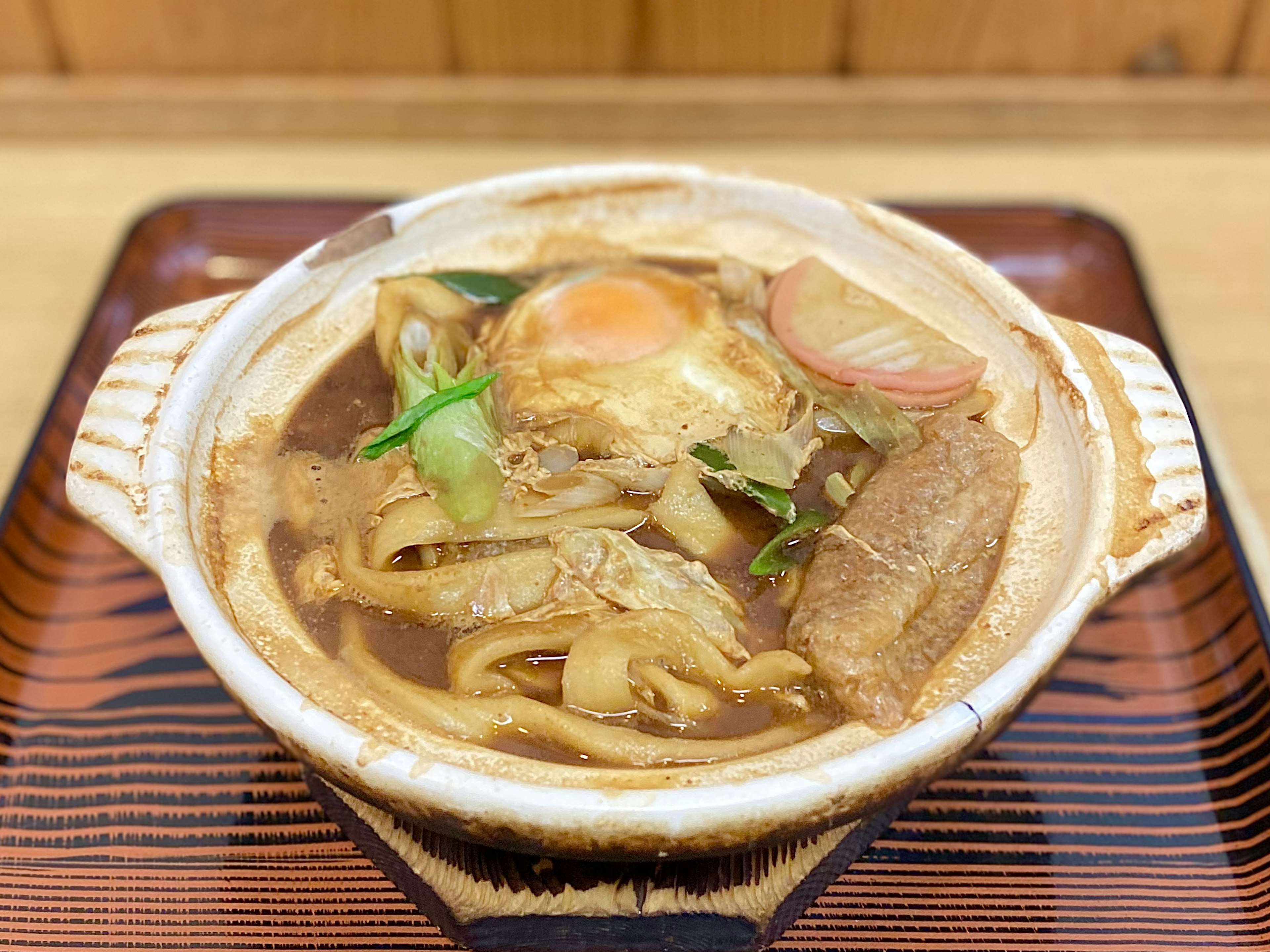 Hot pot dish with egg, vegetables, and meat