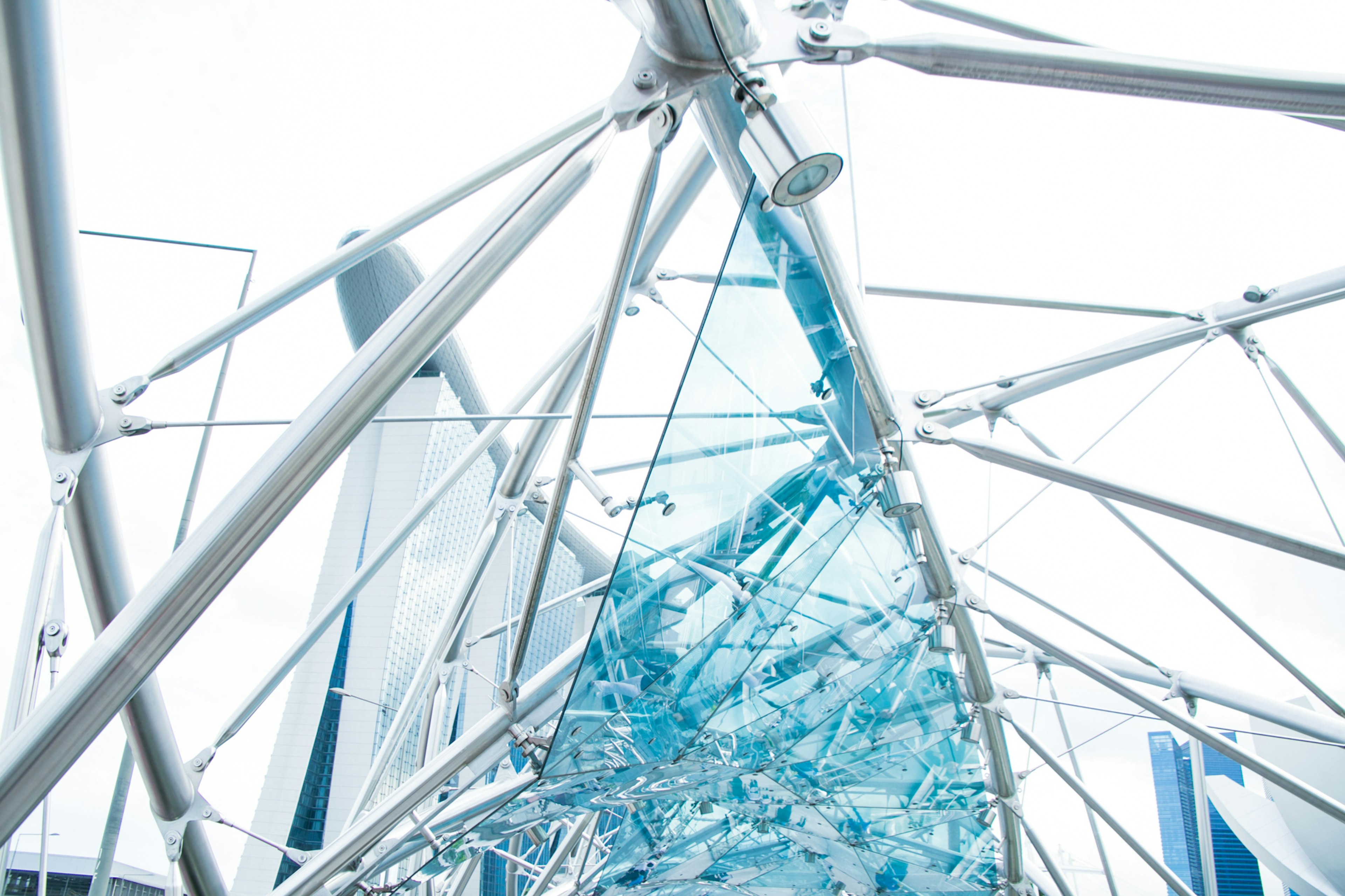 Structural design featuring blue glass and metallic framework