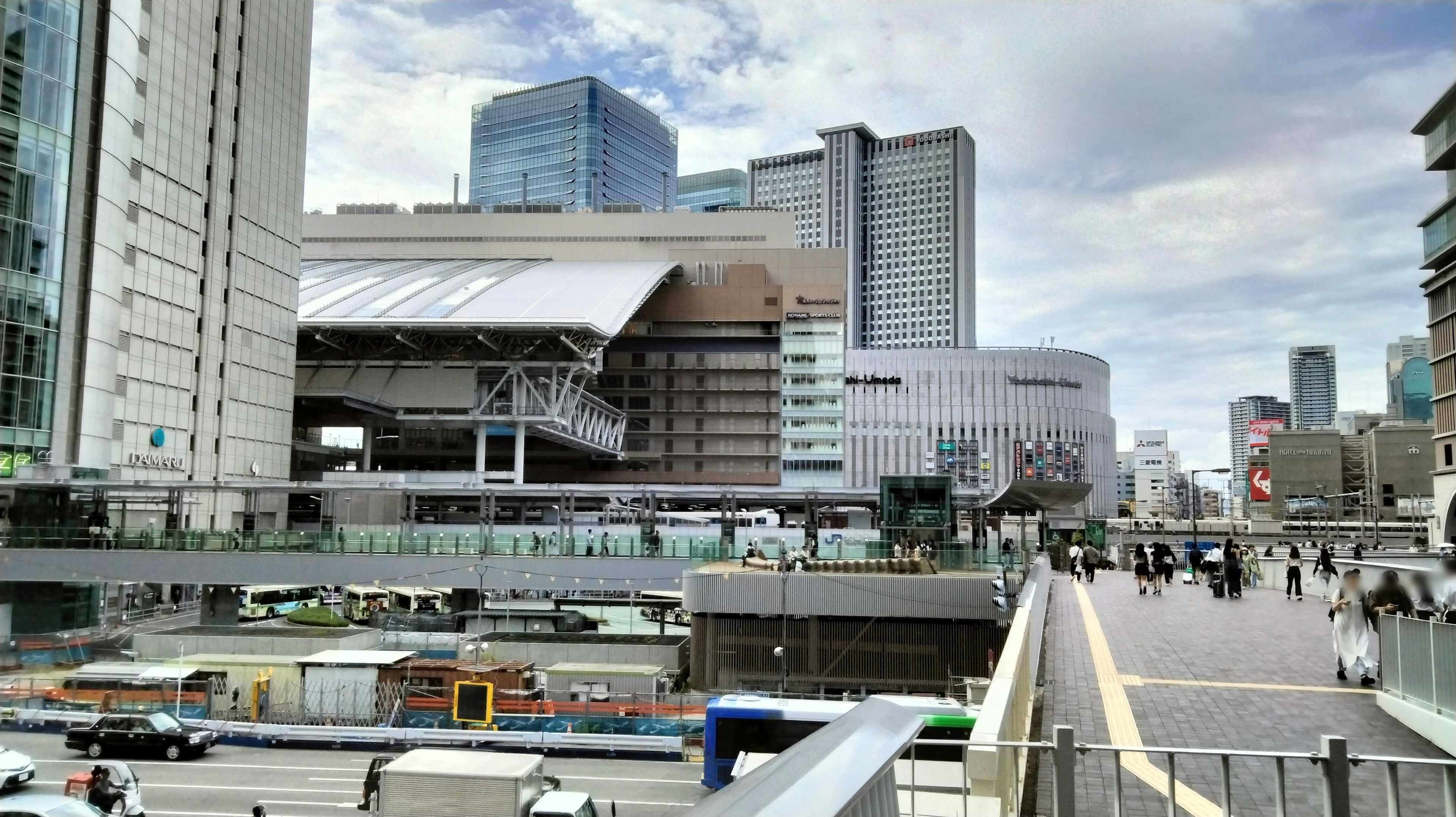 Modern cityscape featuring tall buildings and bustling pedestrians