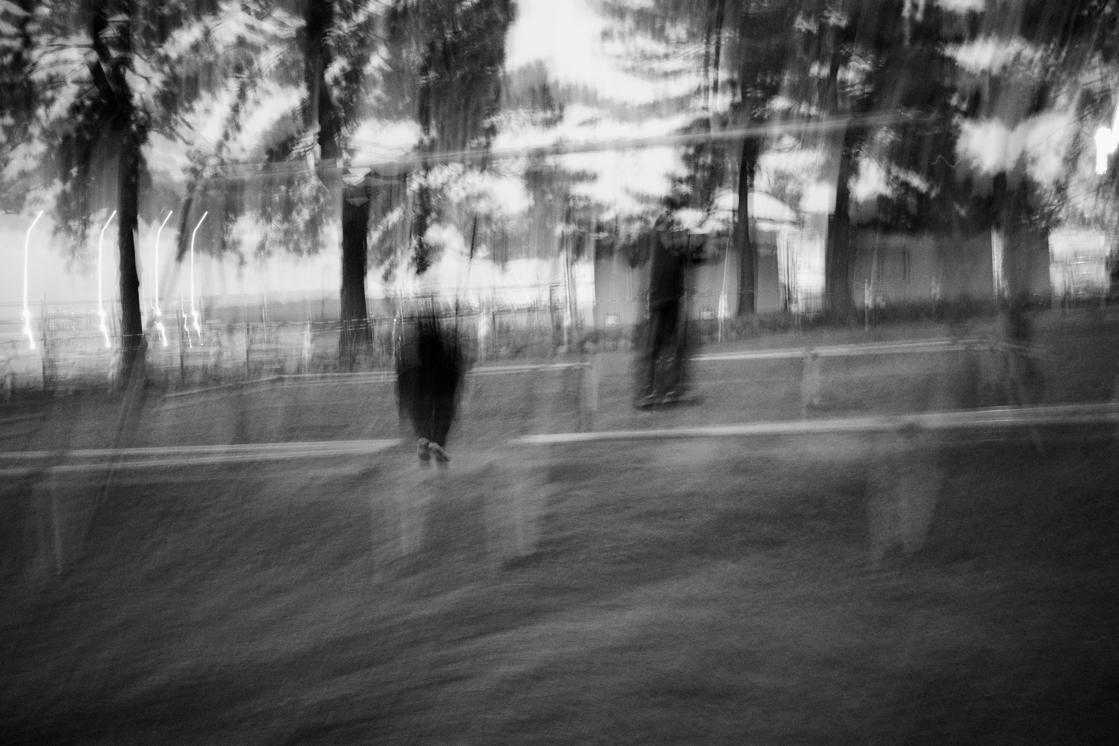 Blurred black and white scene with people walking