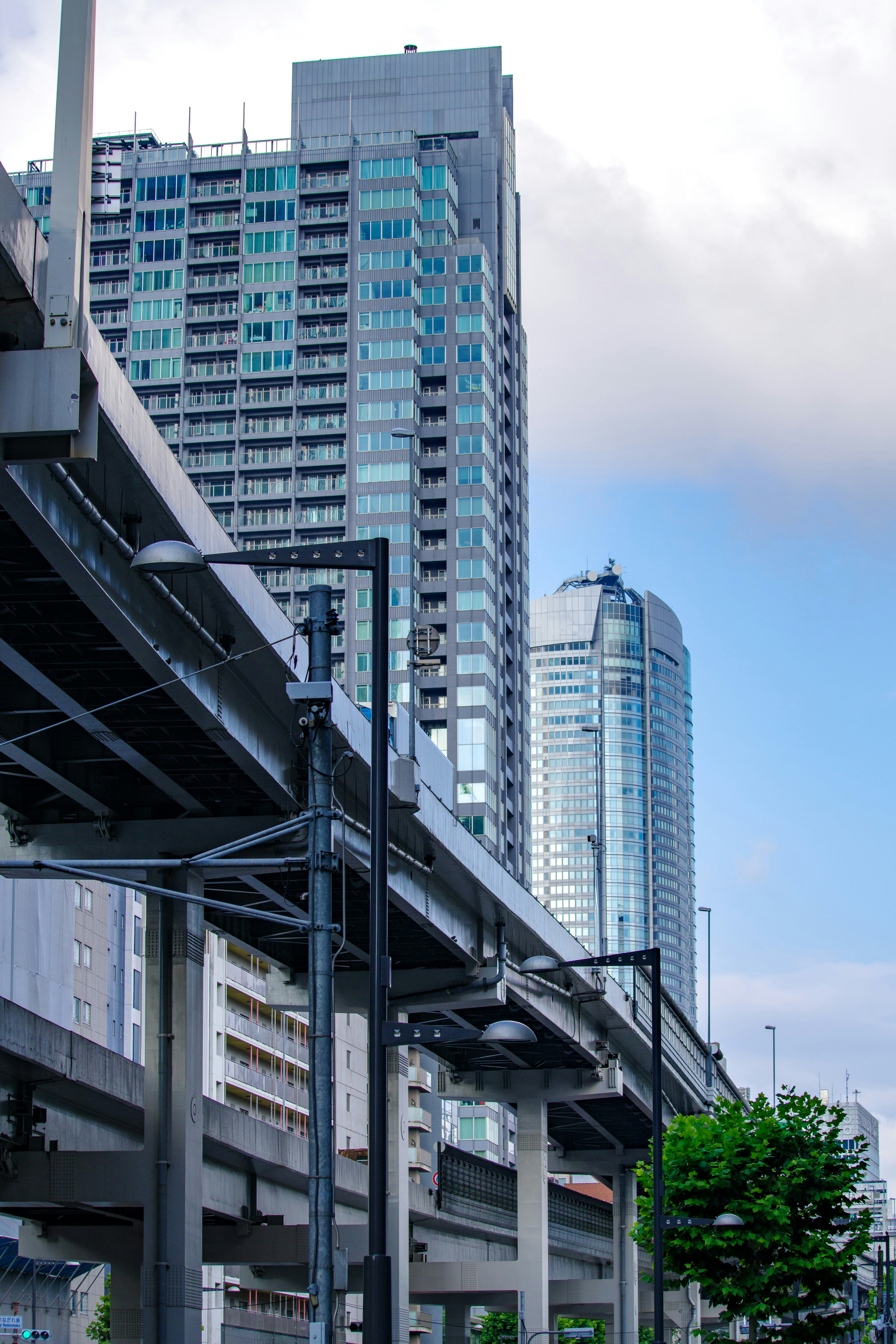 Urban landscape featuring skyscrapers and an elevated roadway