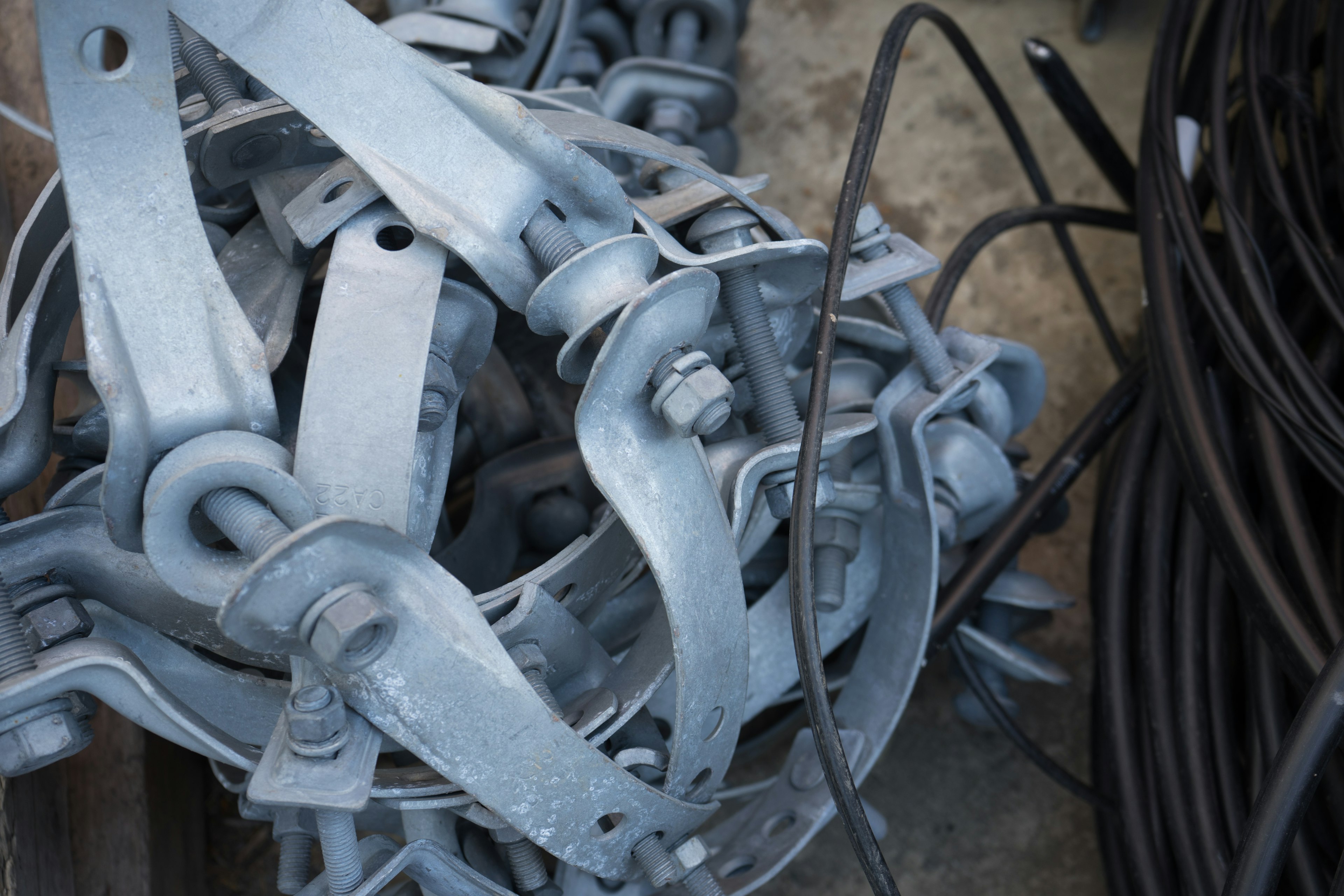 Image of stacked metal clamps and wires