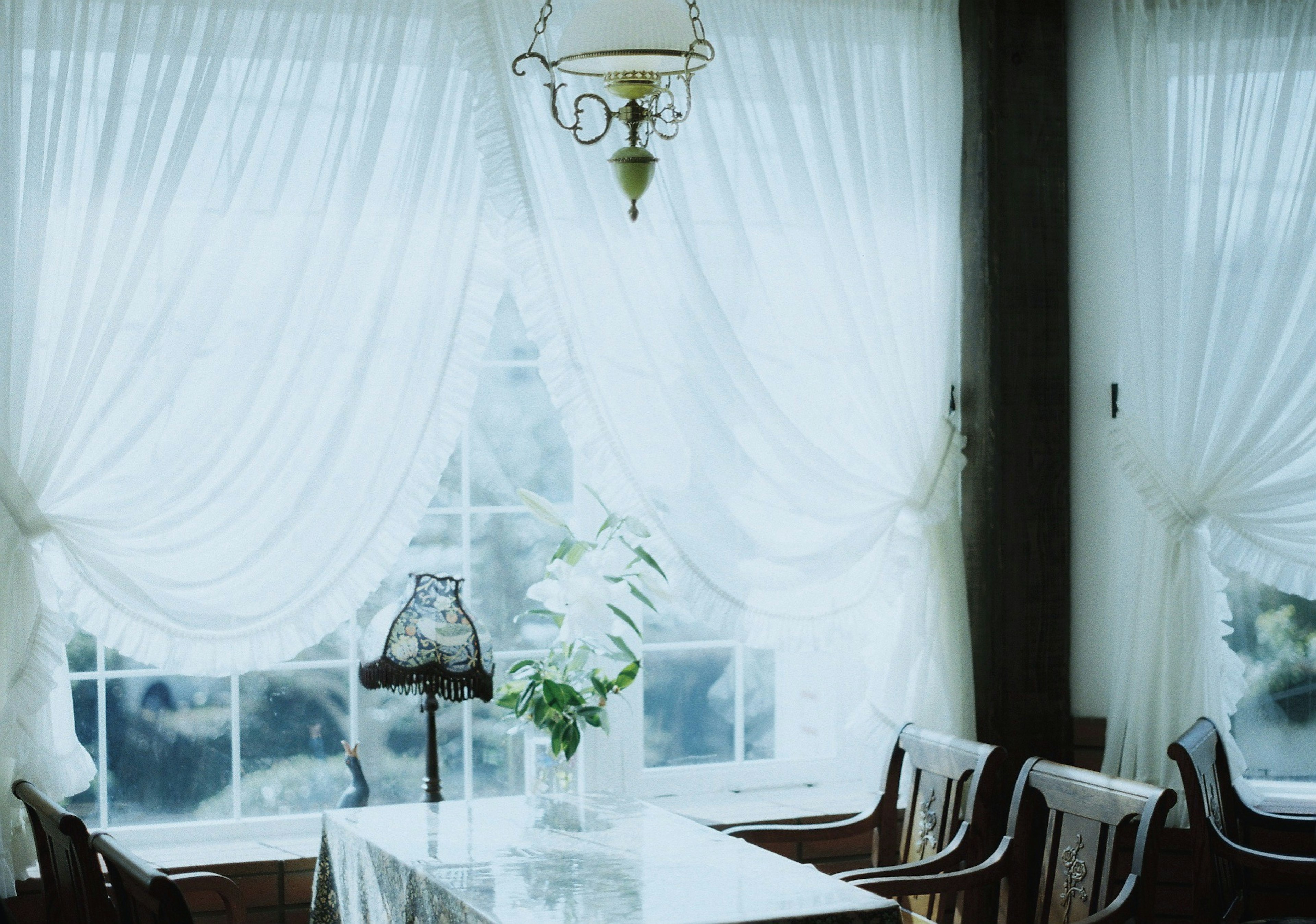 Elegant interior with white curtains and a table