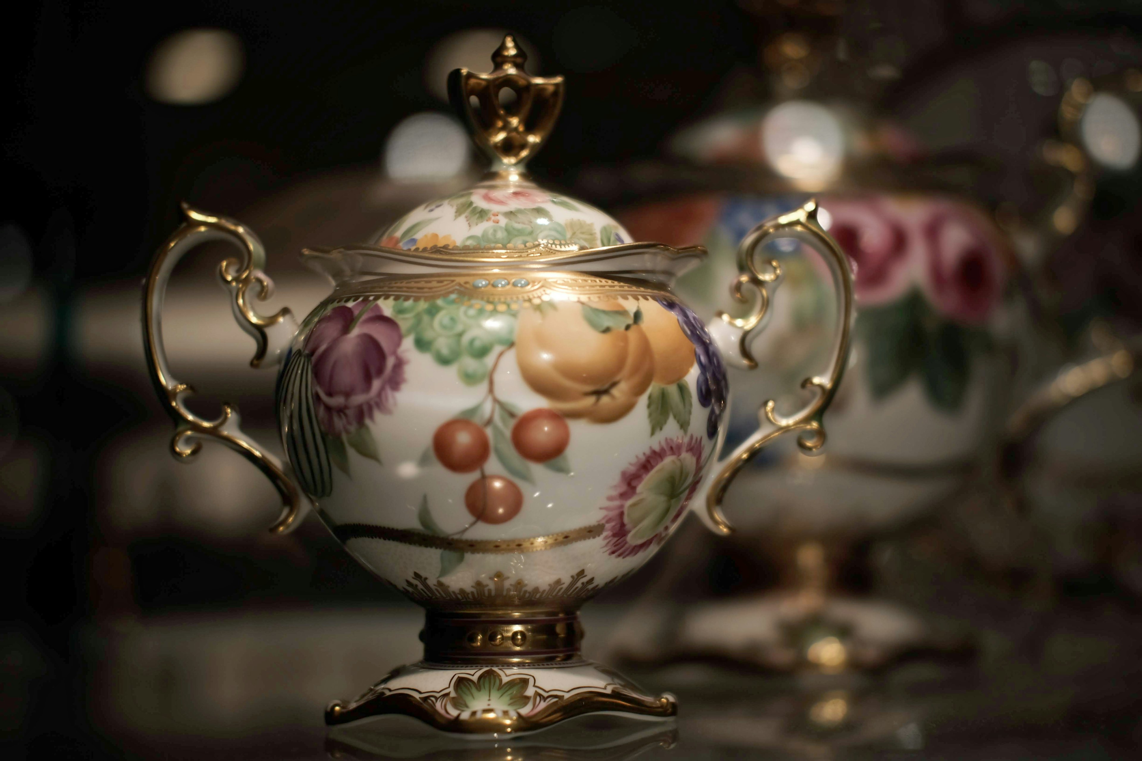 Decorative porcelain jar with floral patterns and gold accents