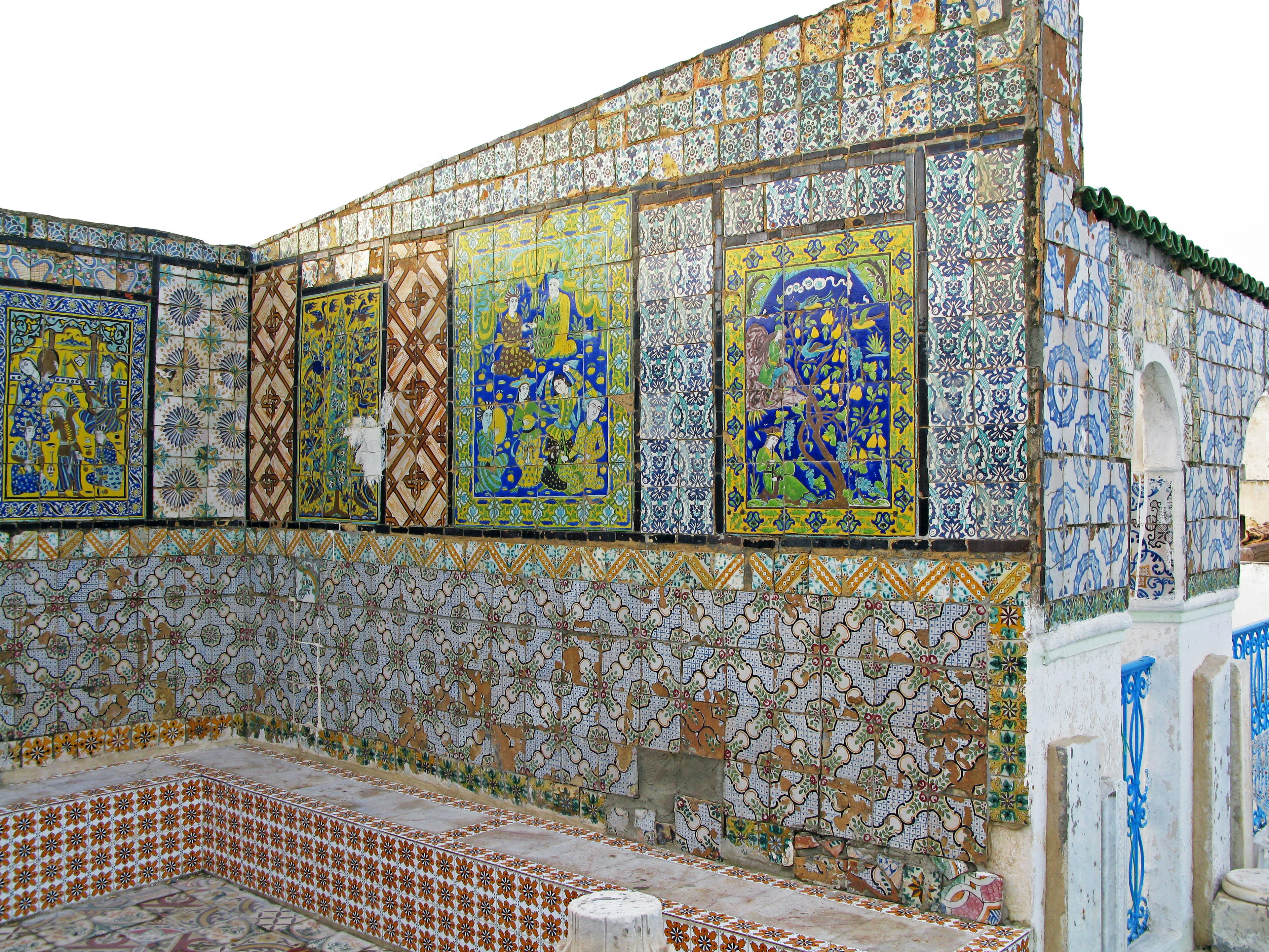 Colorful tiled wall with intricate designs and traditional architecture