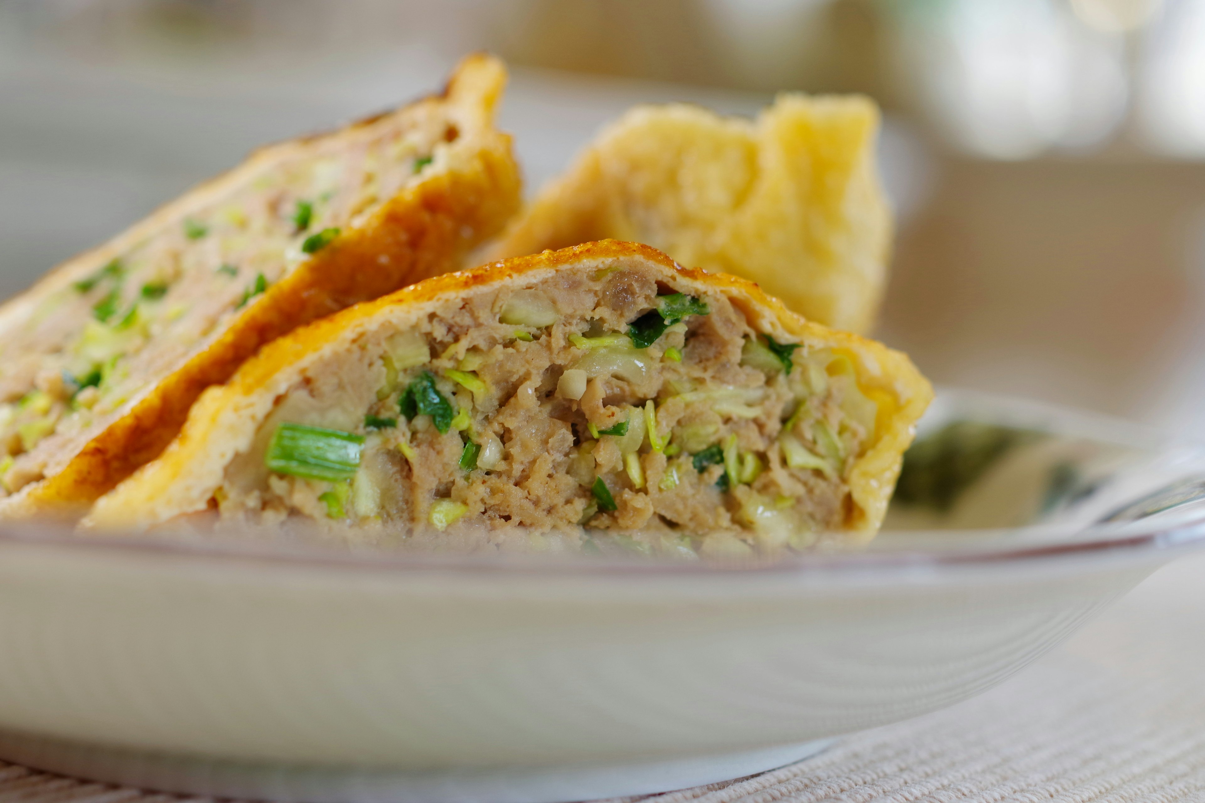 Cross-section of a fluffy dish filled with ingredients