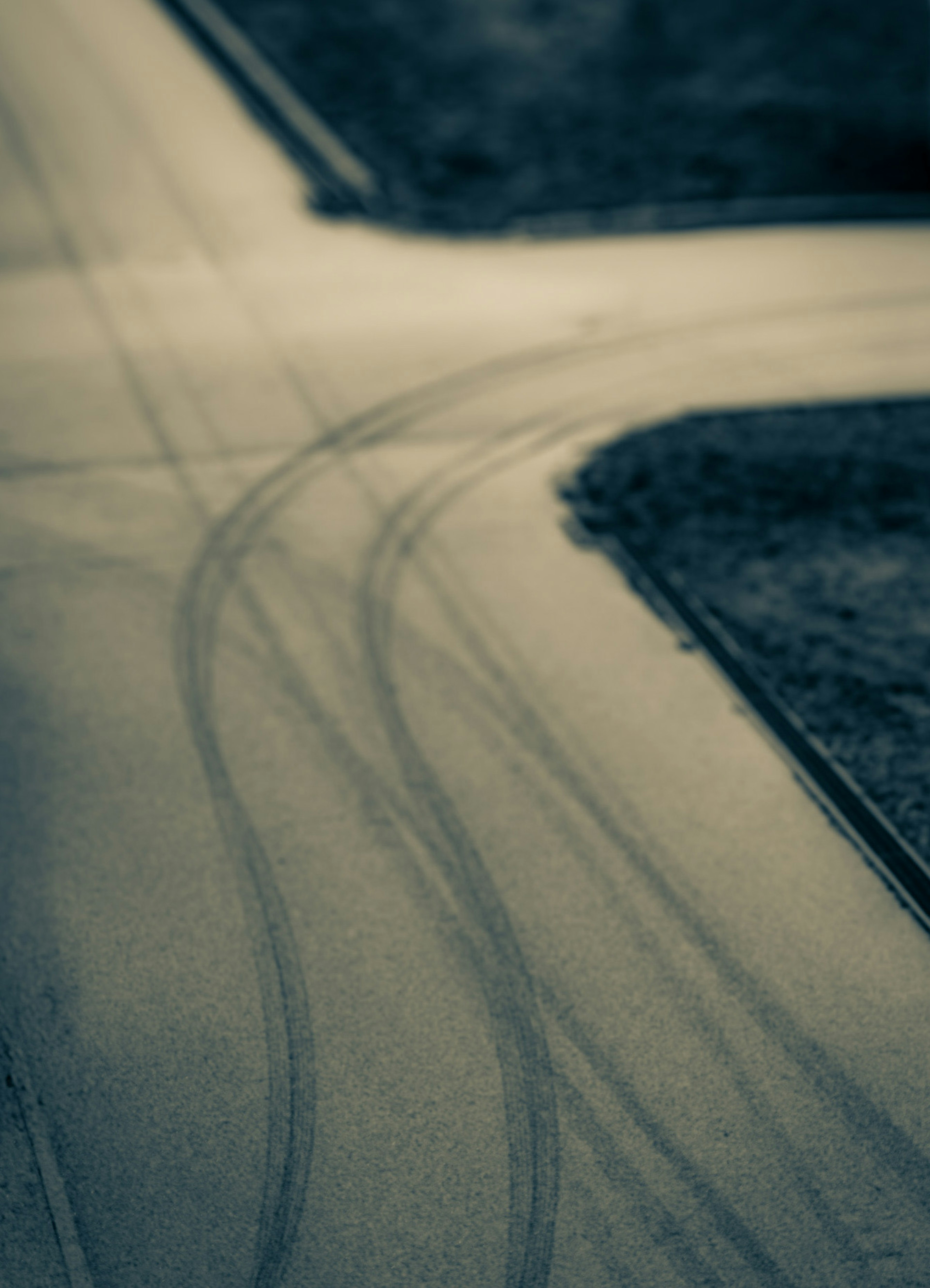 Aerial view of tire tracks on an intersection road