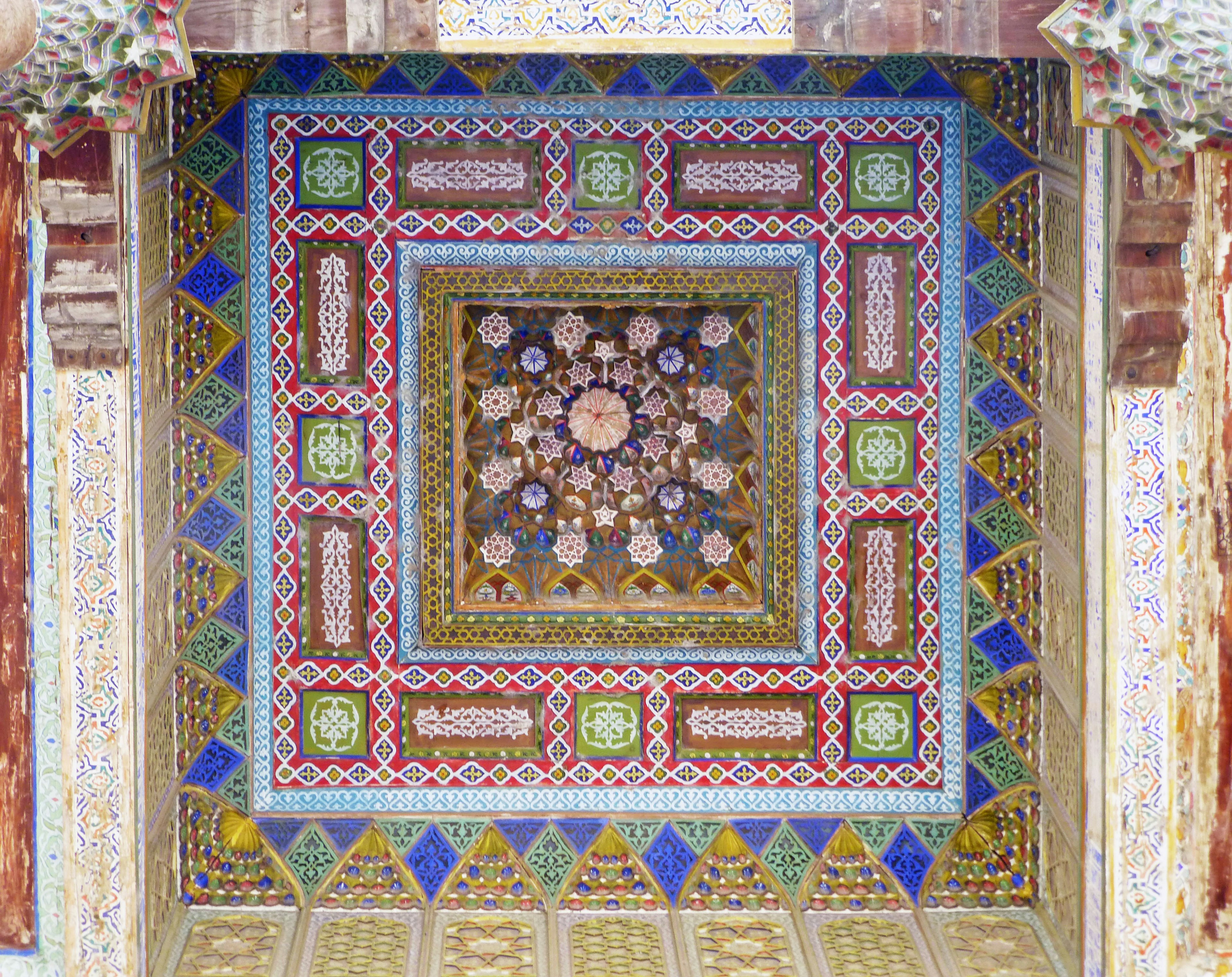 Beautiful mosaic tile ceiling decoration featuring colorful geometric patterns and floral motifs