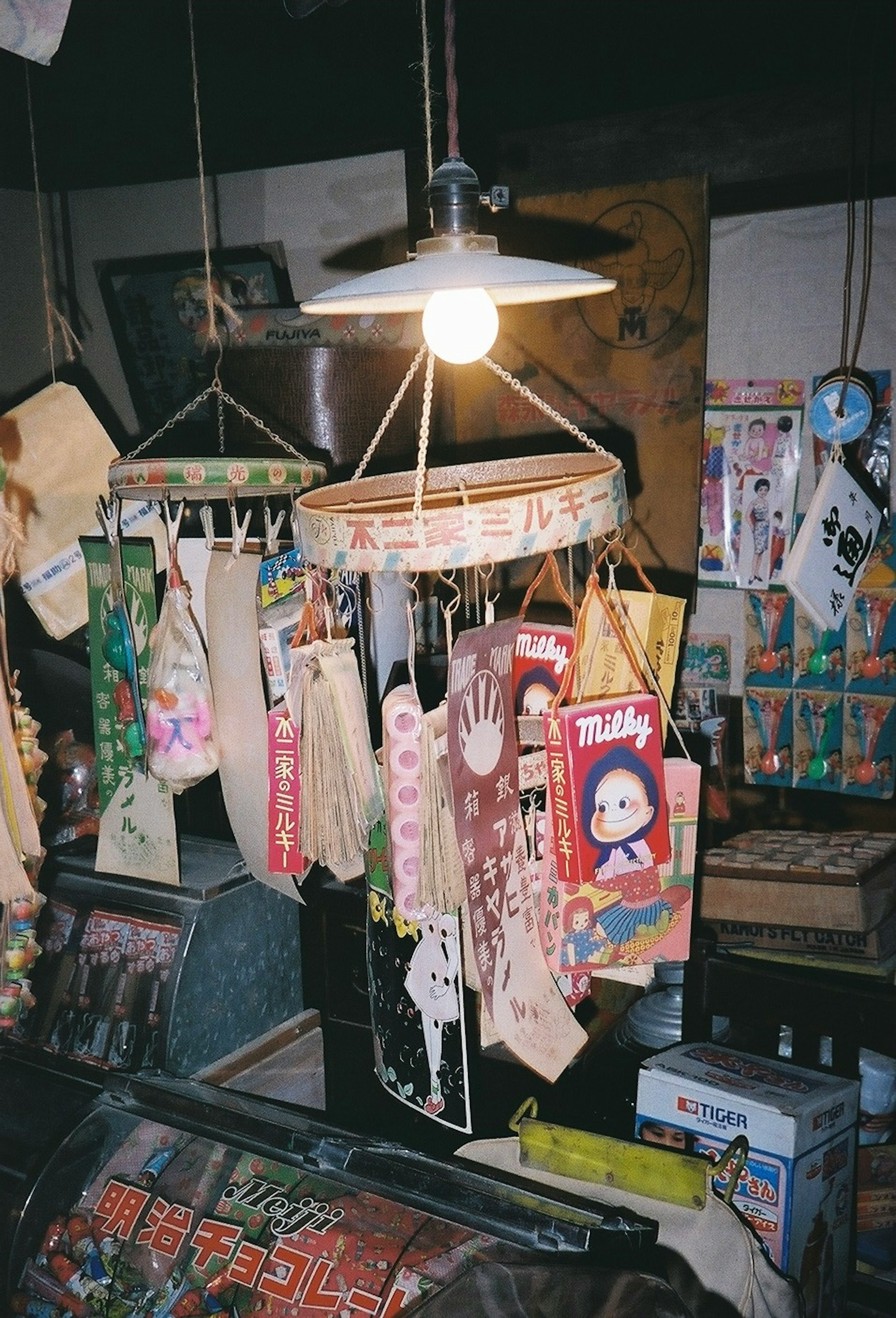 Hanging decorations and bright lamp in an old shop