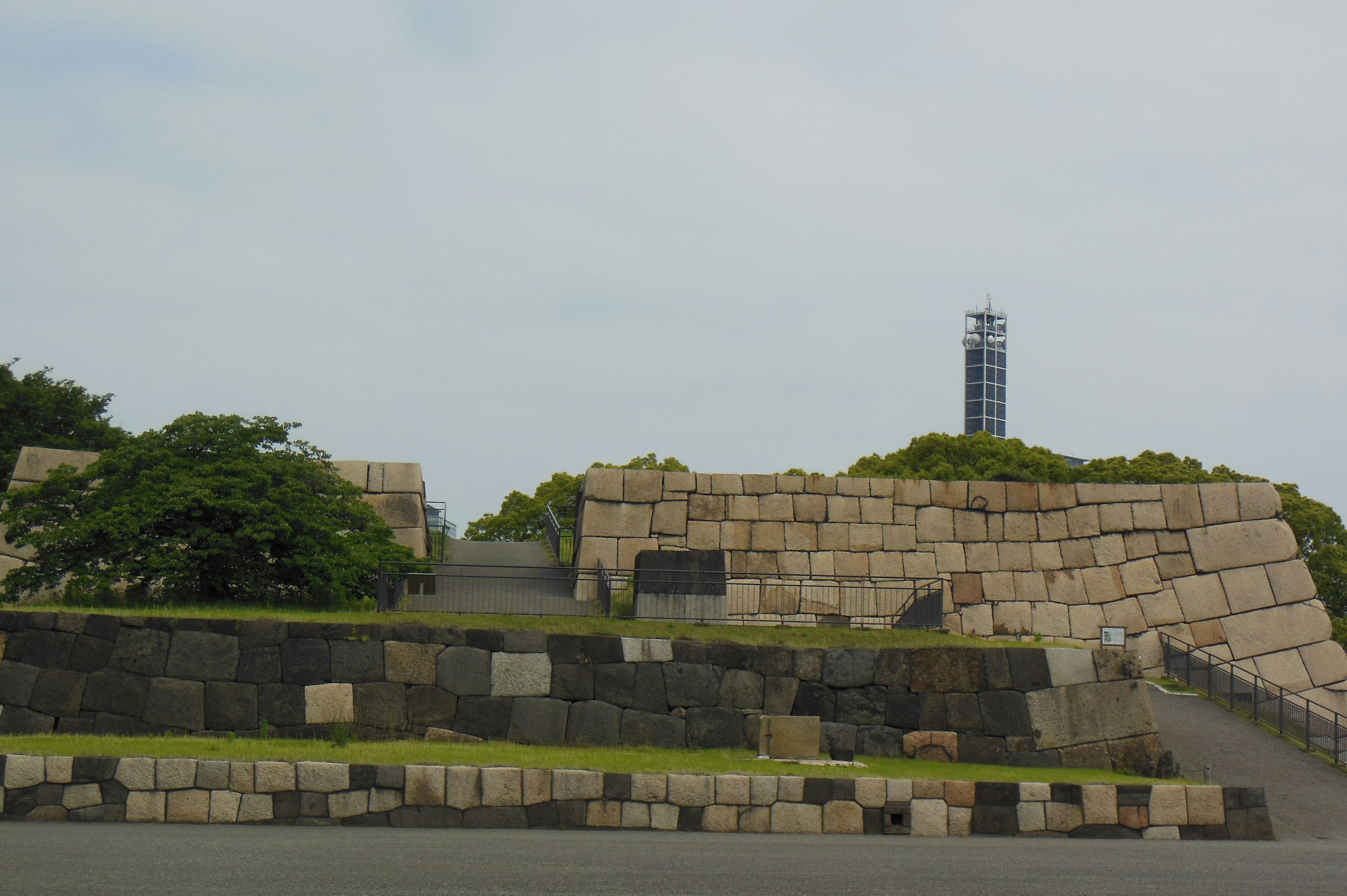 A landscape featuring stone structures and surrounding greenery