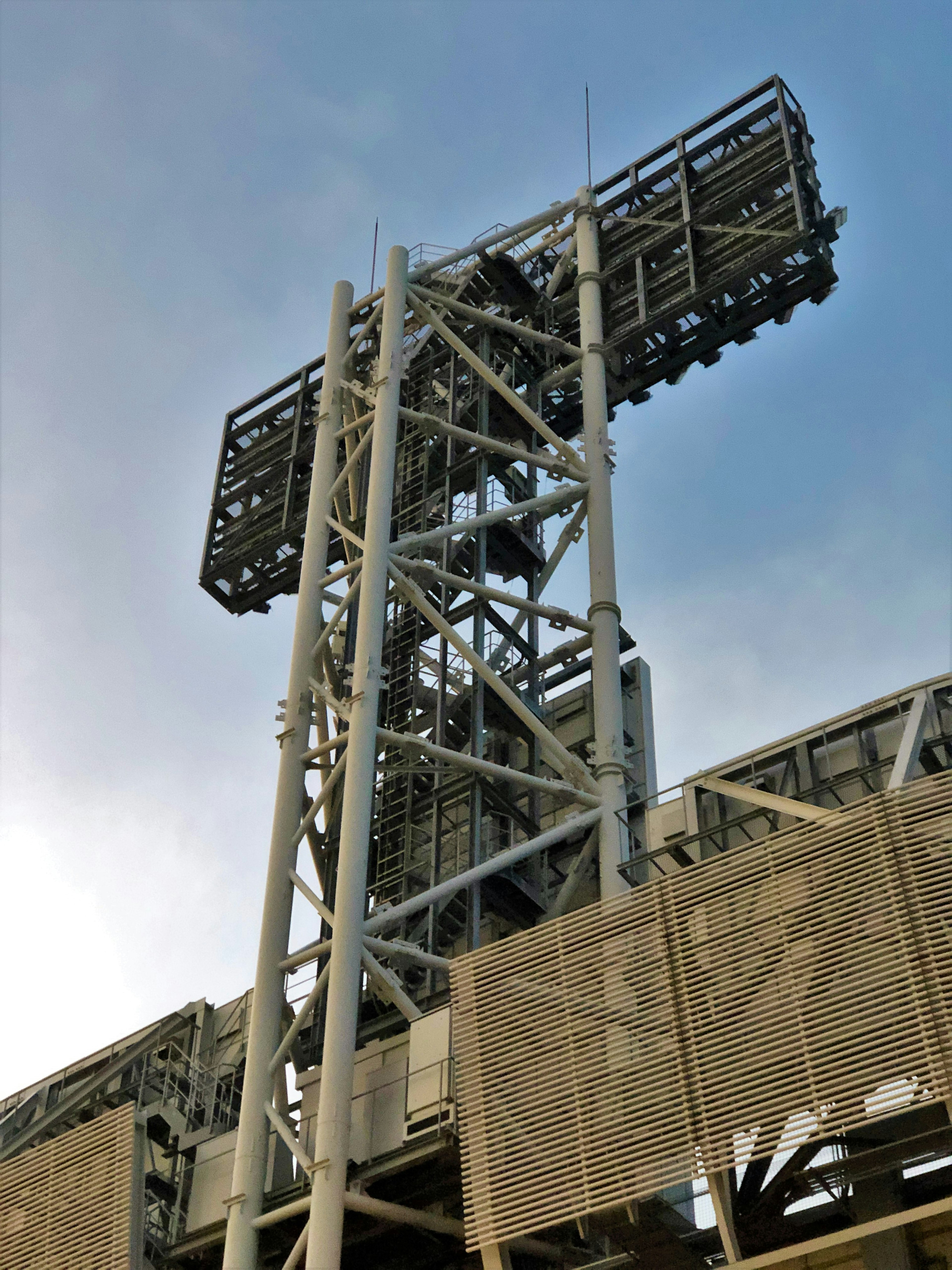 Stadium lighting tower with structural supports