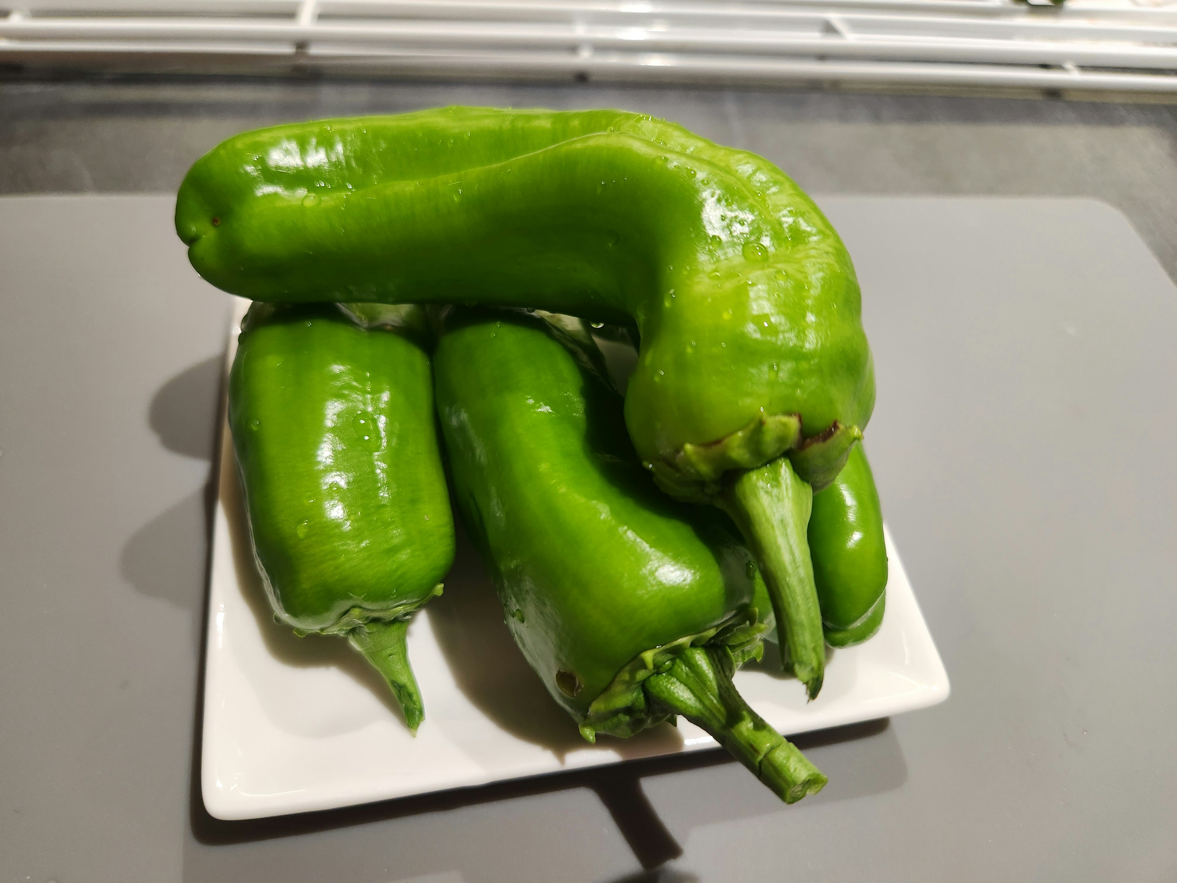 Green peppers arranged on a plate