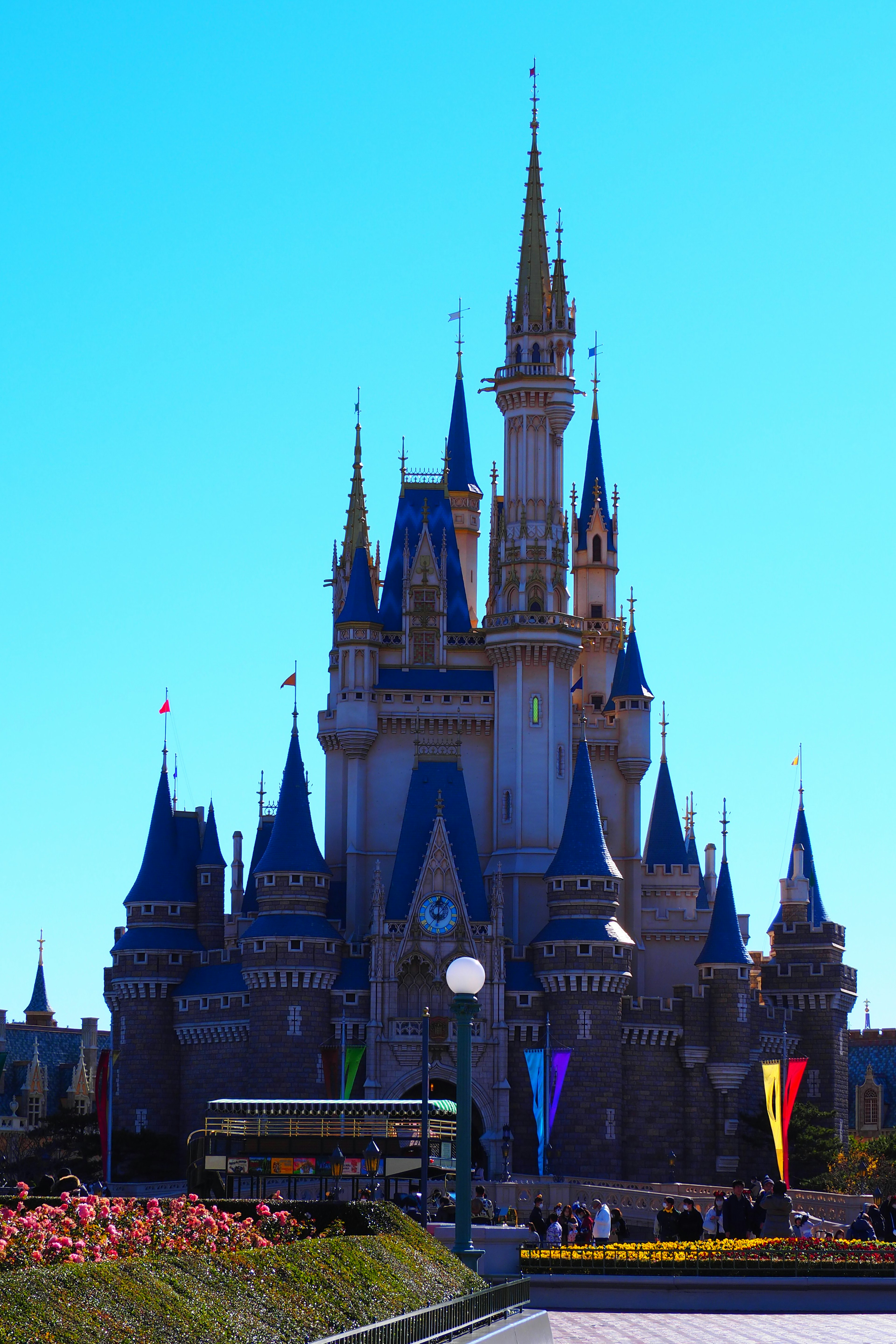 Cinderella Castle at Disneyland under a clear blue sky