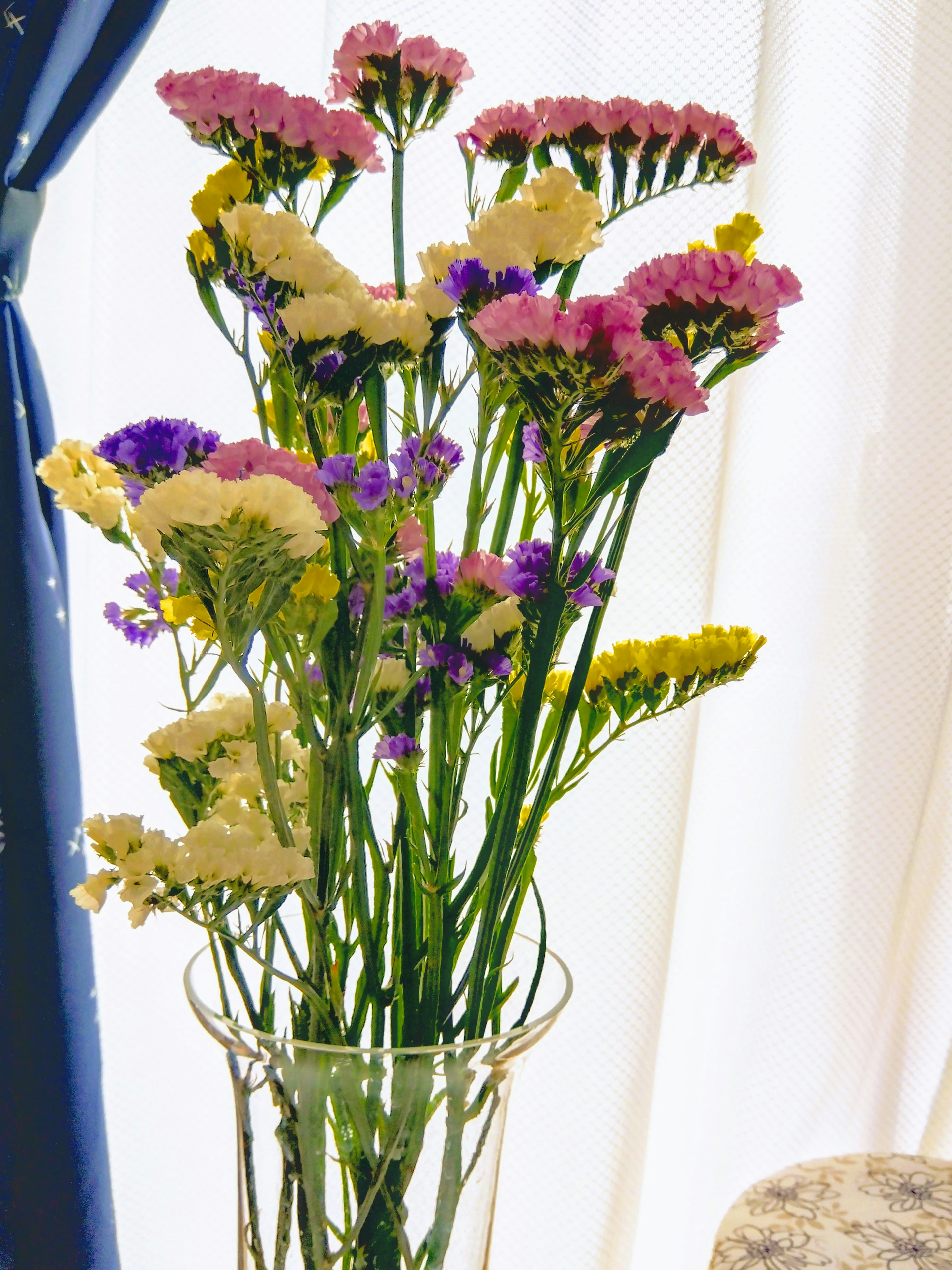 A colorful bouquet of flowers arranged in a glass vase