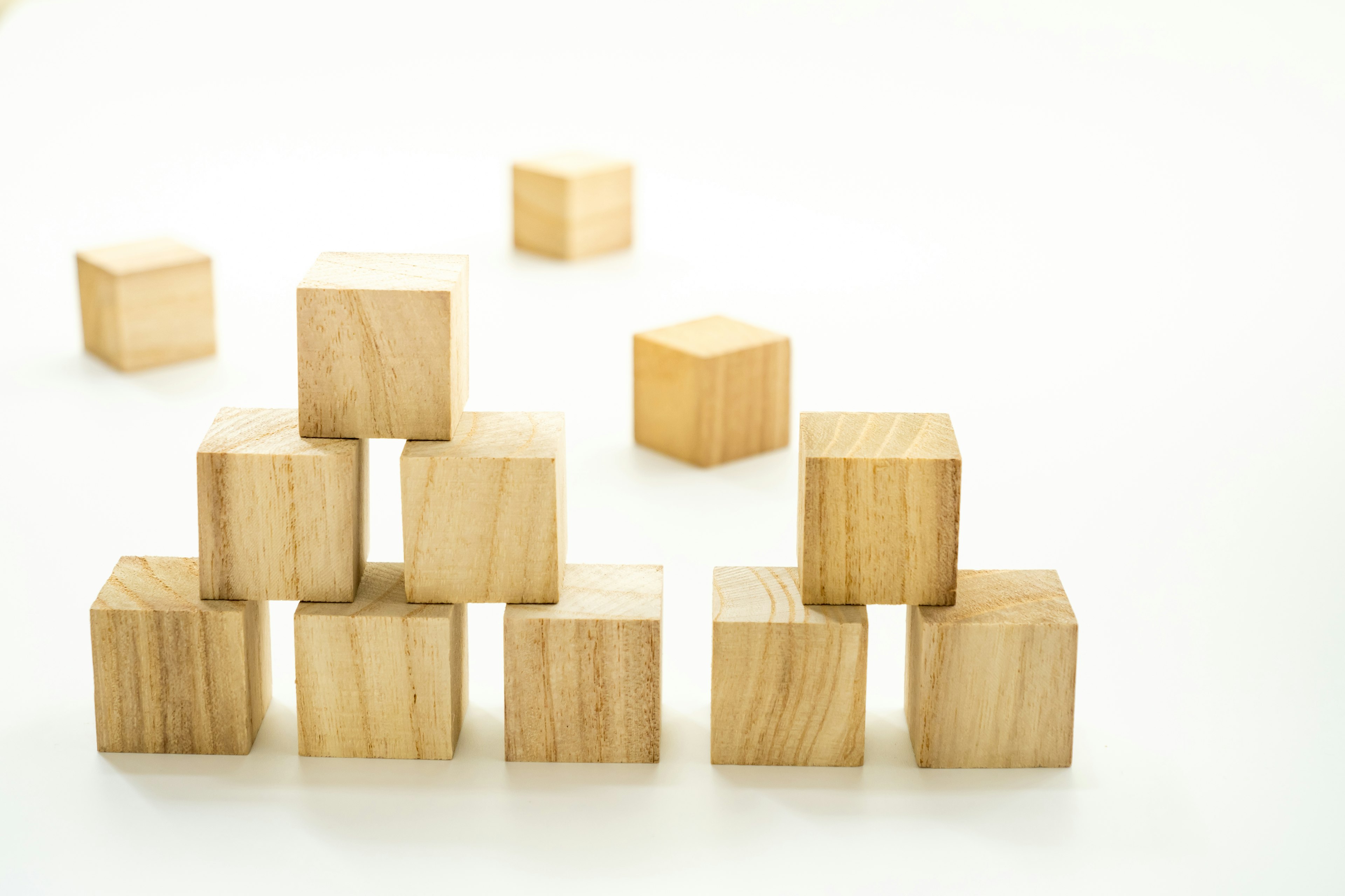 Simple arrangement of wooden cubes stacked in a pyramid shape