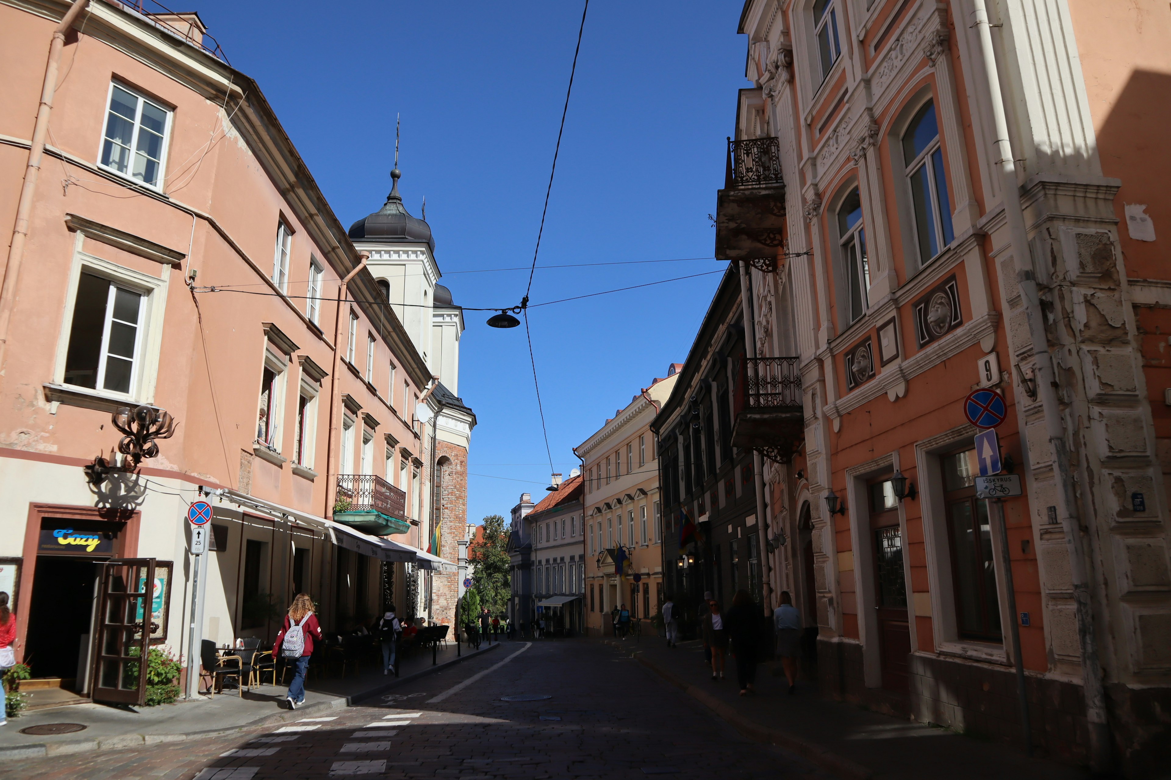 Charming street scene with colorful buildings and clear blue sky