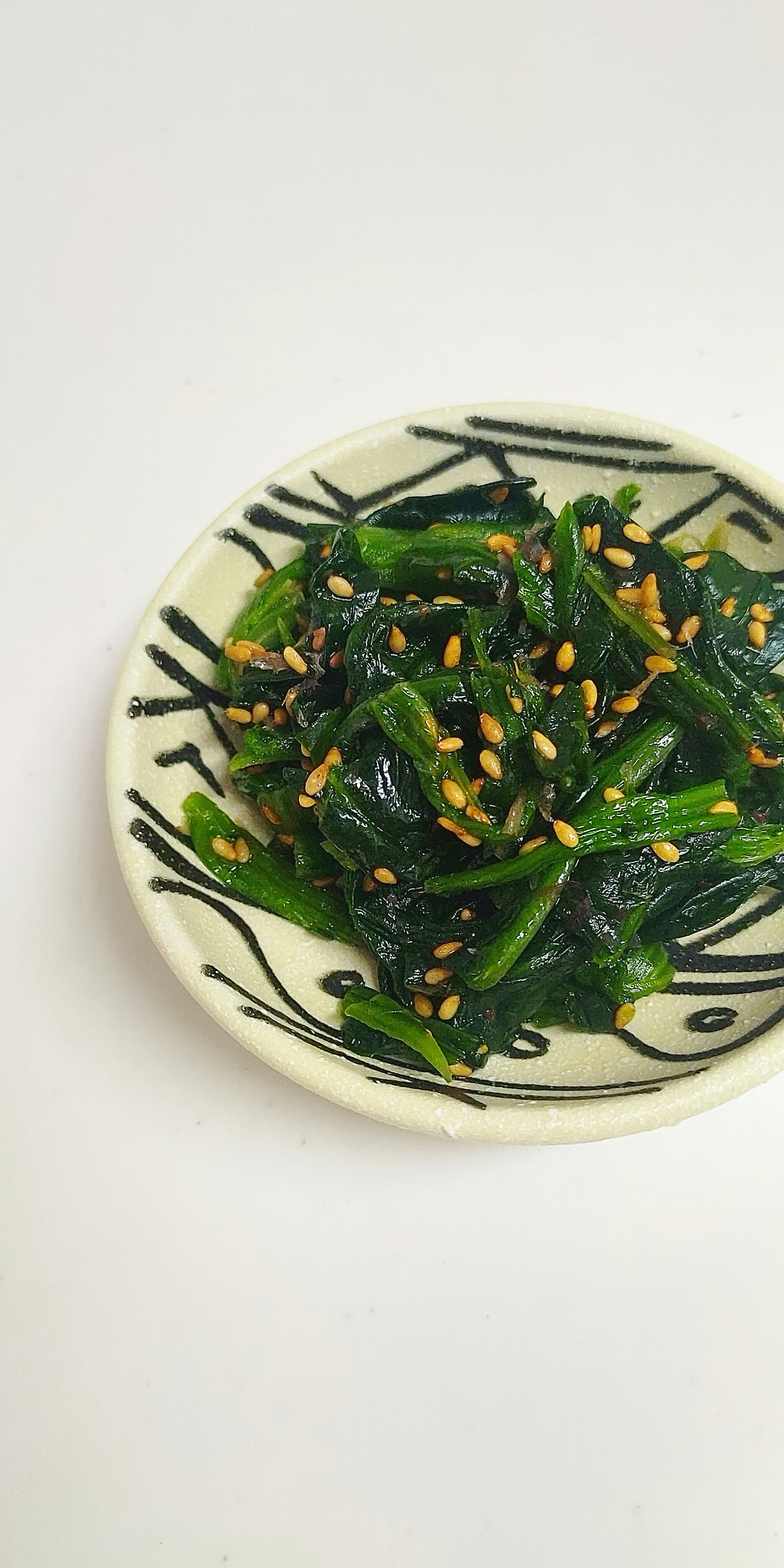 Plate of green vegetables and nuts