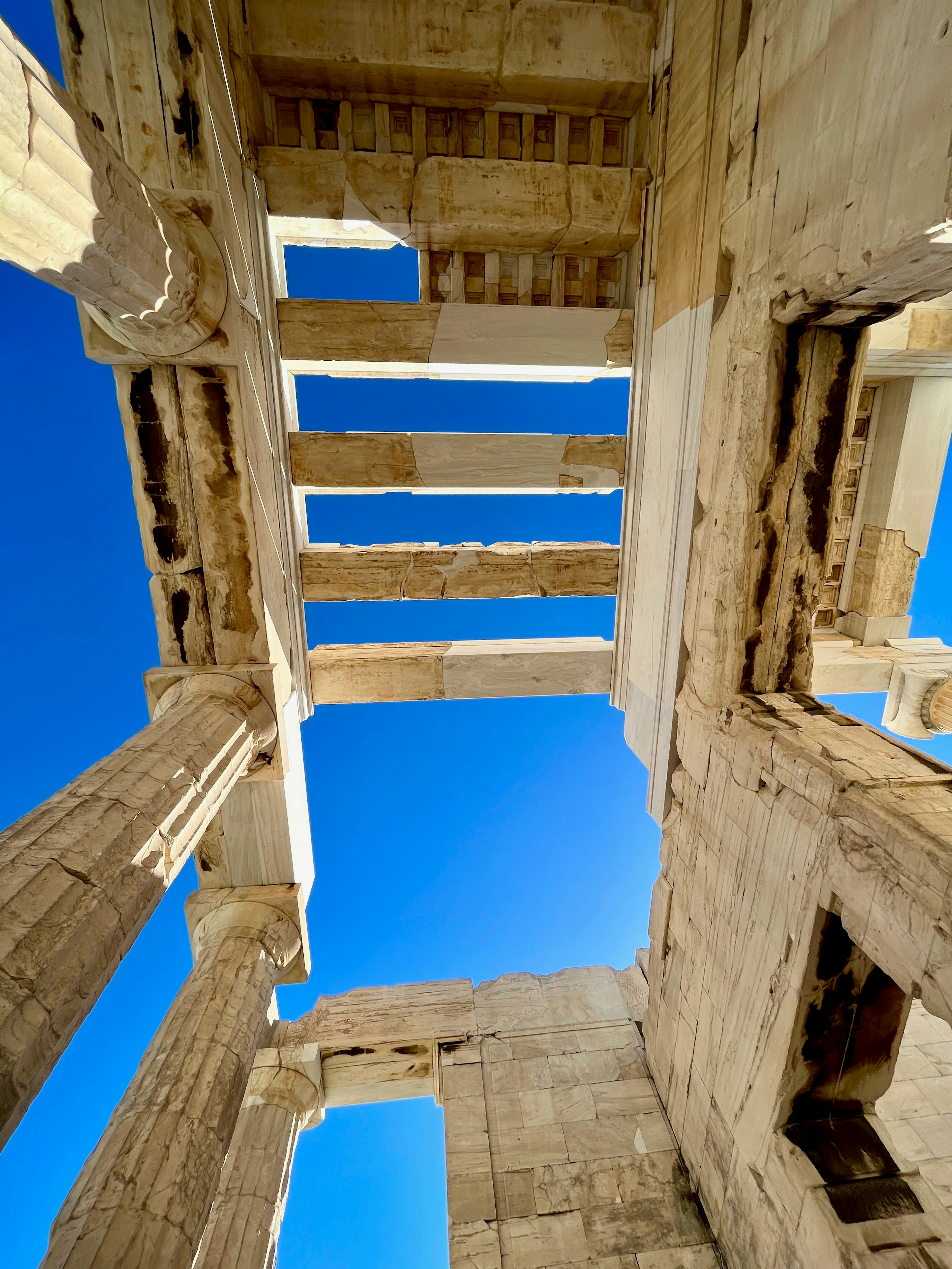 Interior view of ancient ruins under a blue sky