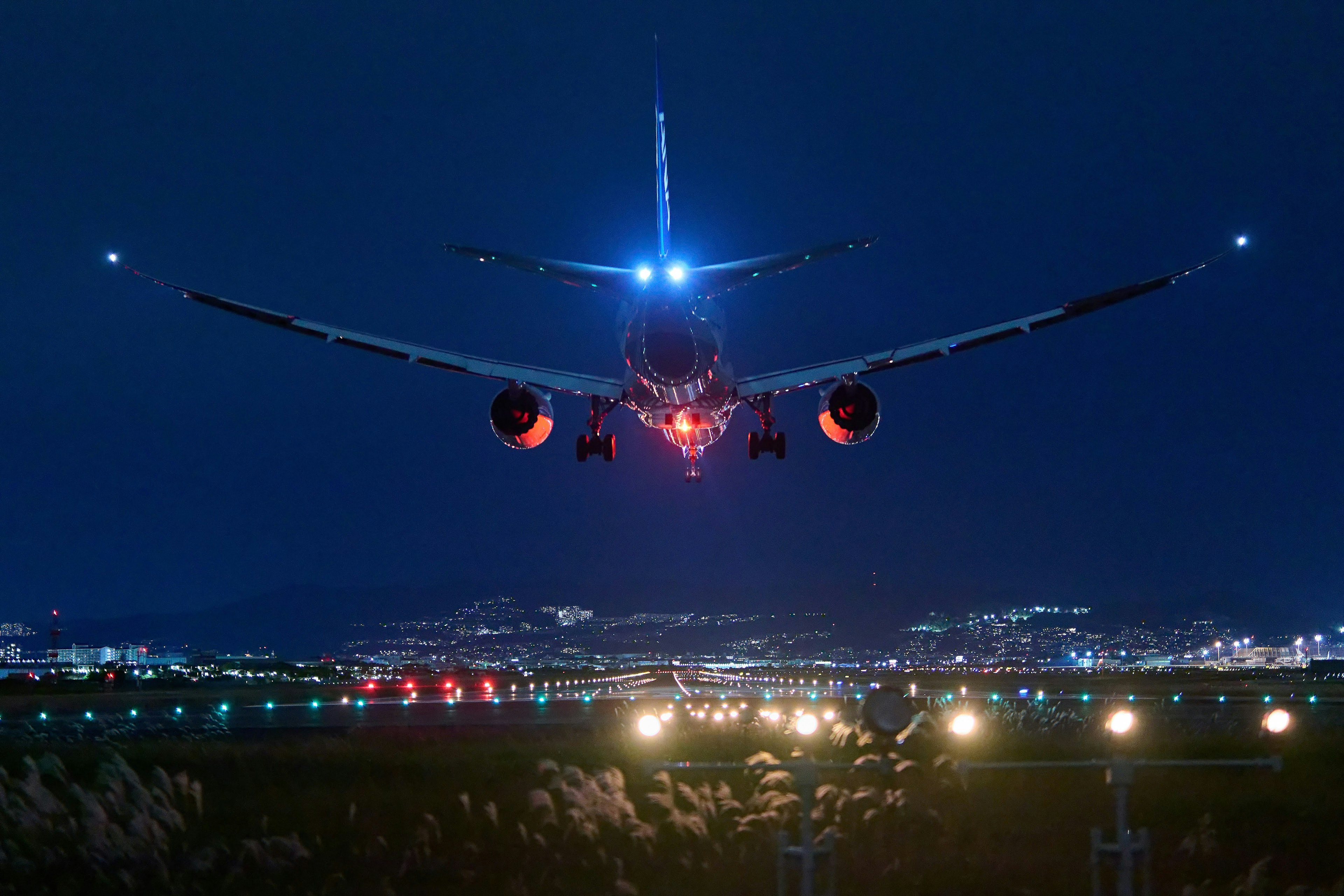 Landing scene of an airplane against a night sky Aircraft lights shining