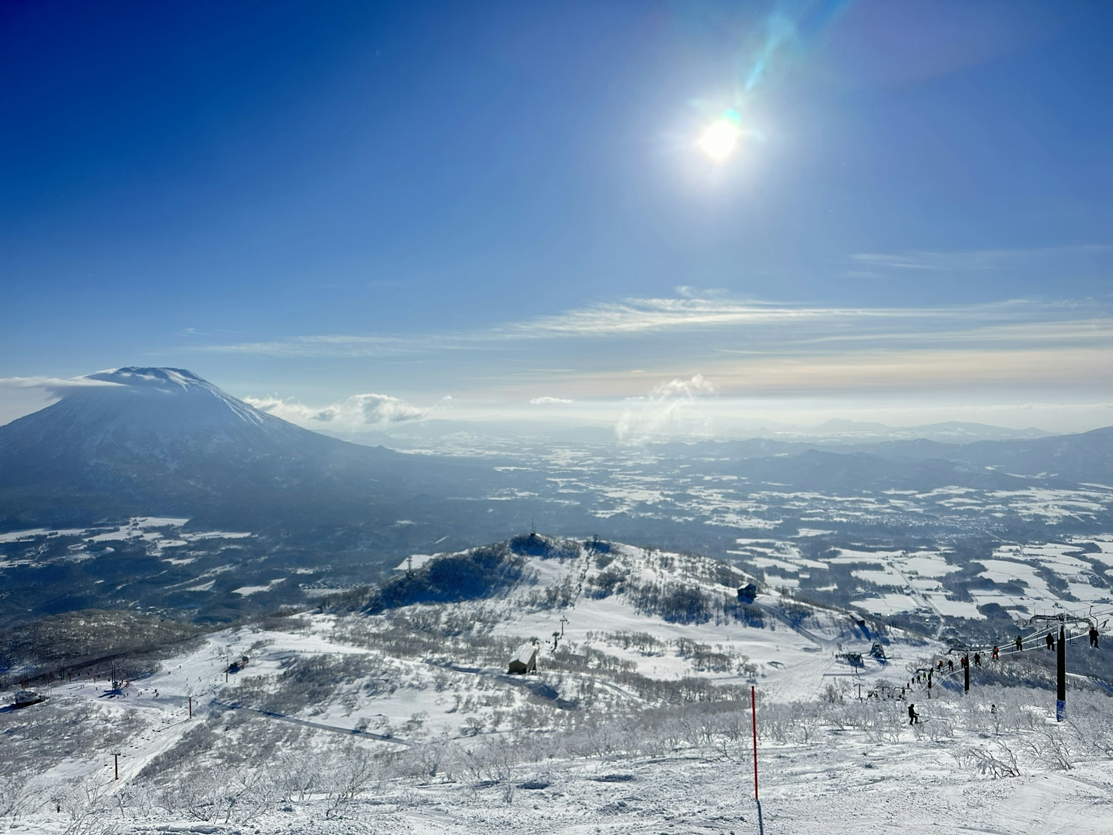 Beautiful snowy landscape with mountain view under blue sky