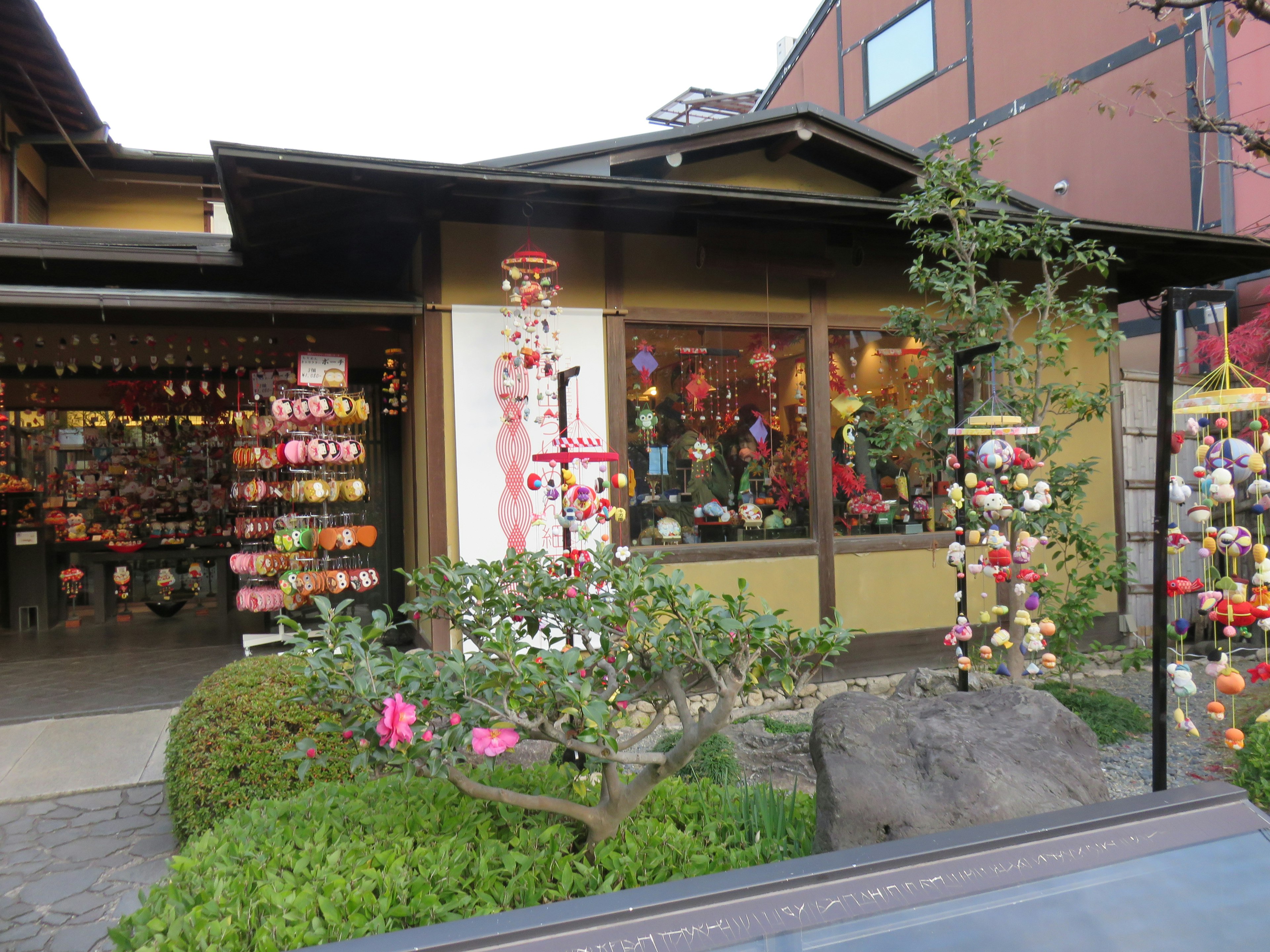 Traditional Japanese shop exterior colorful decorations visible