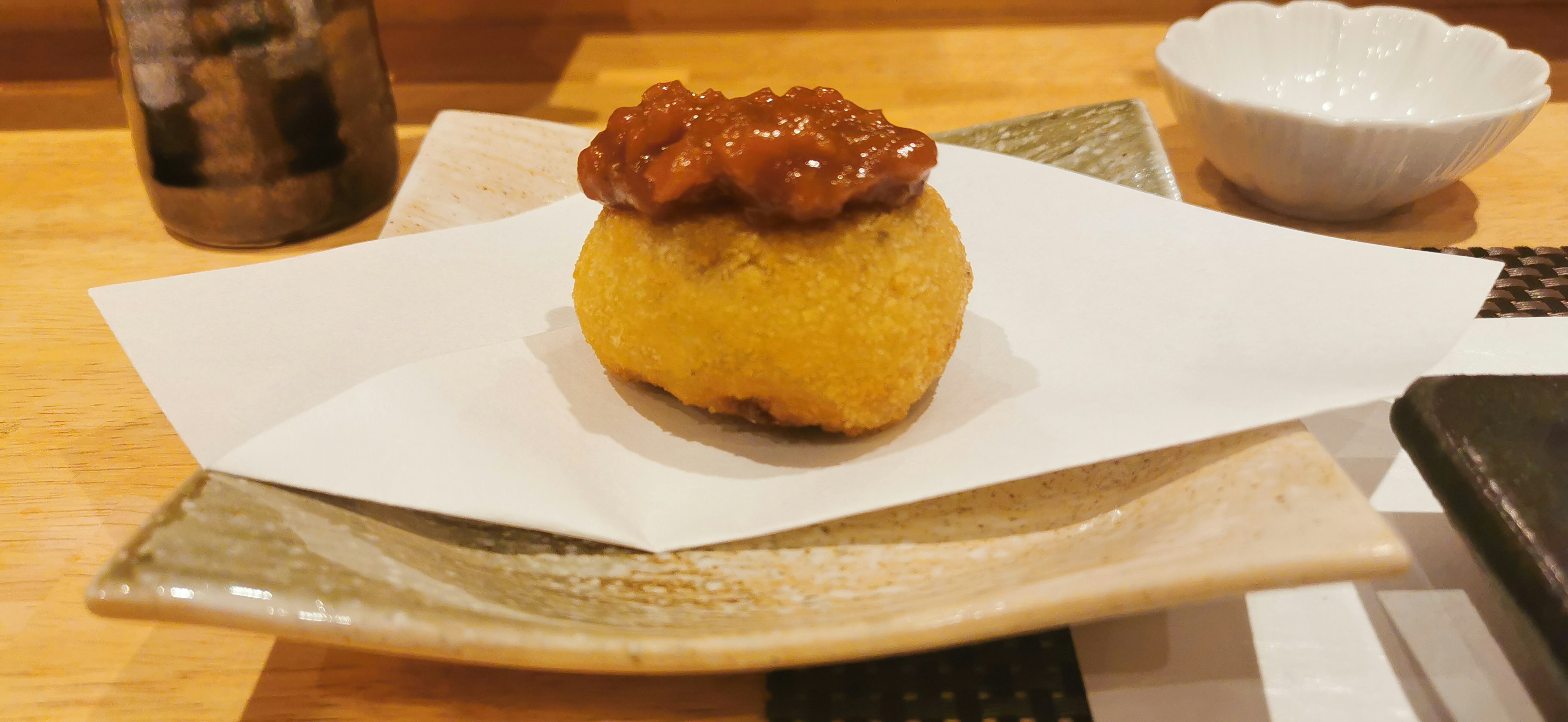 Fried golden dish topped with a sweet sauce