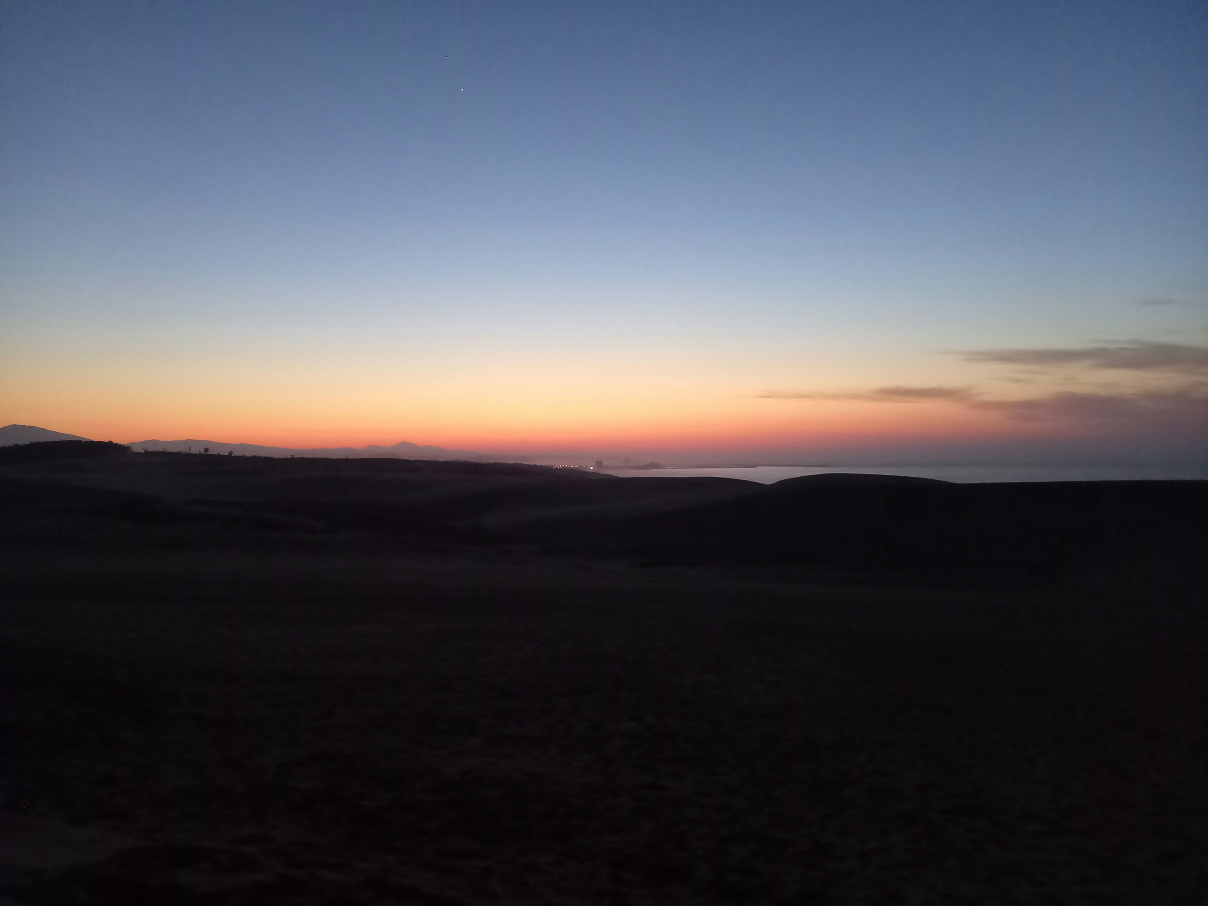 Beautiful twilight sky with horizon silhouette