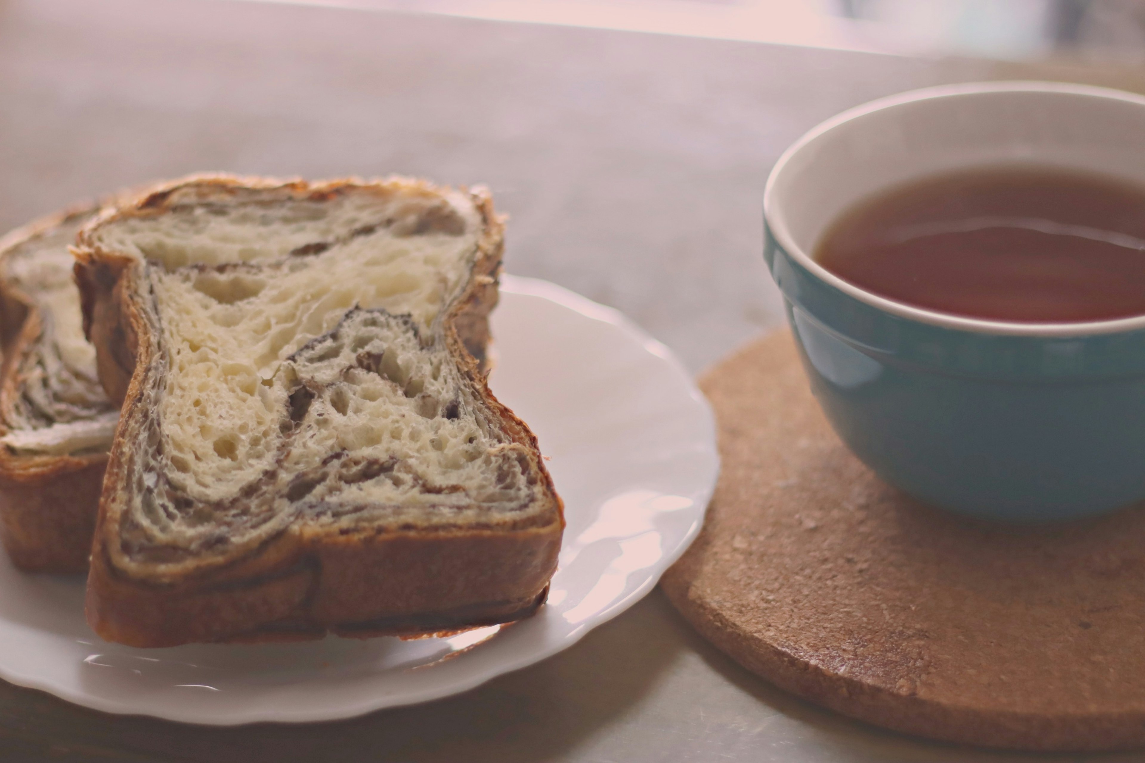 Marble-patterned toast and a blue cup of tea