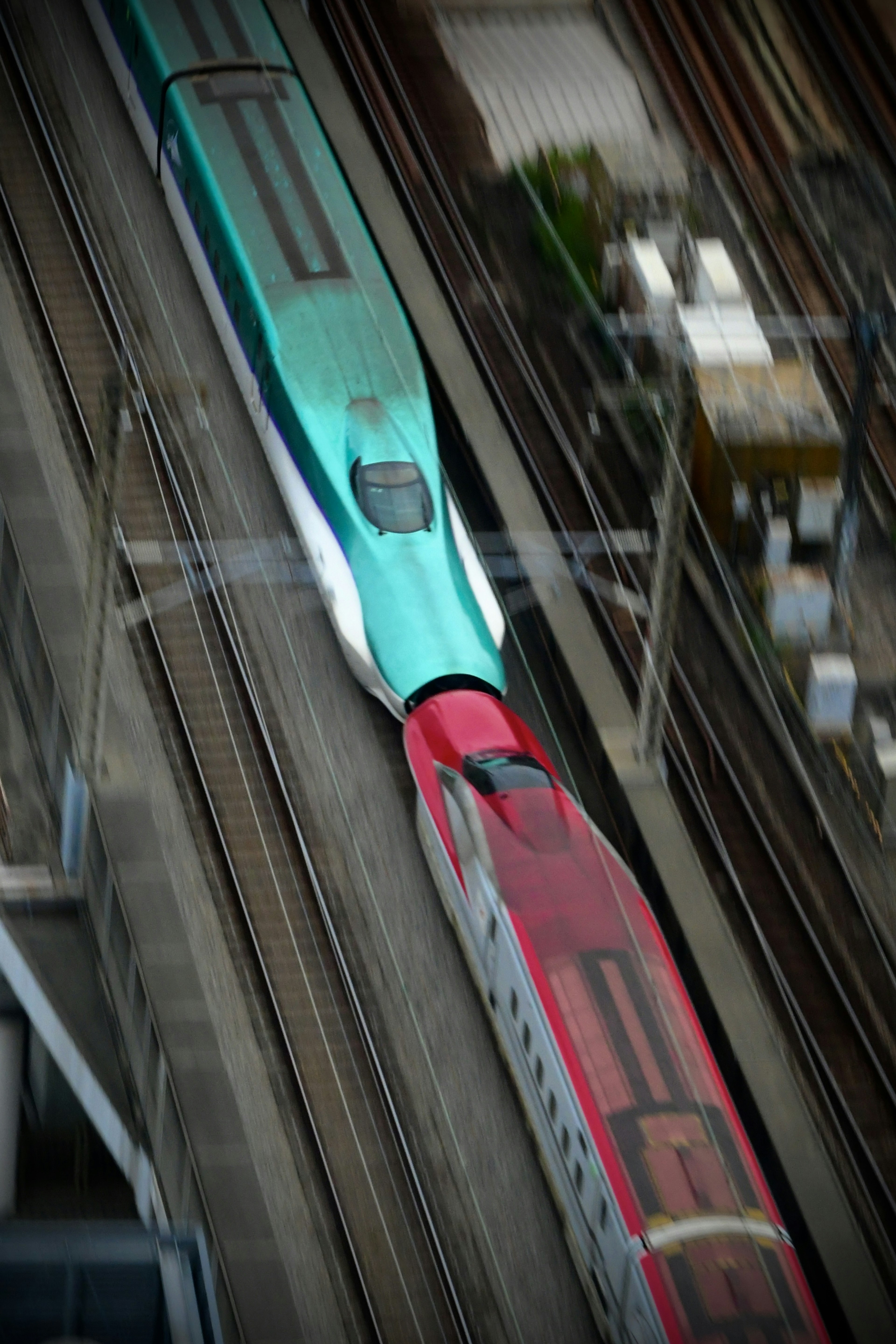 Two Shinkansen trains crossing on the tracks